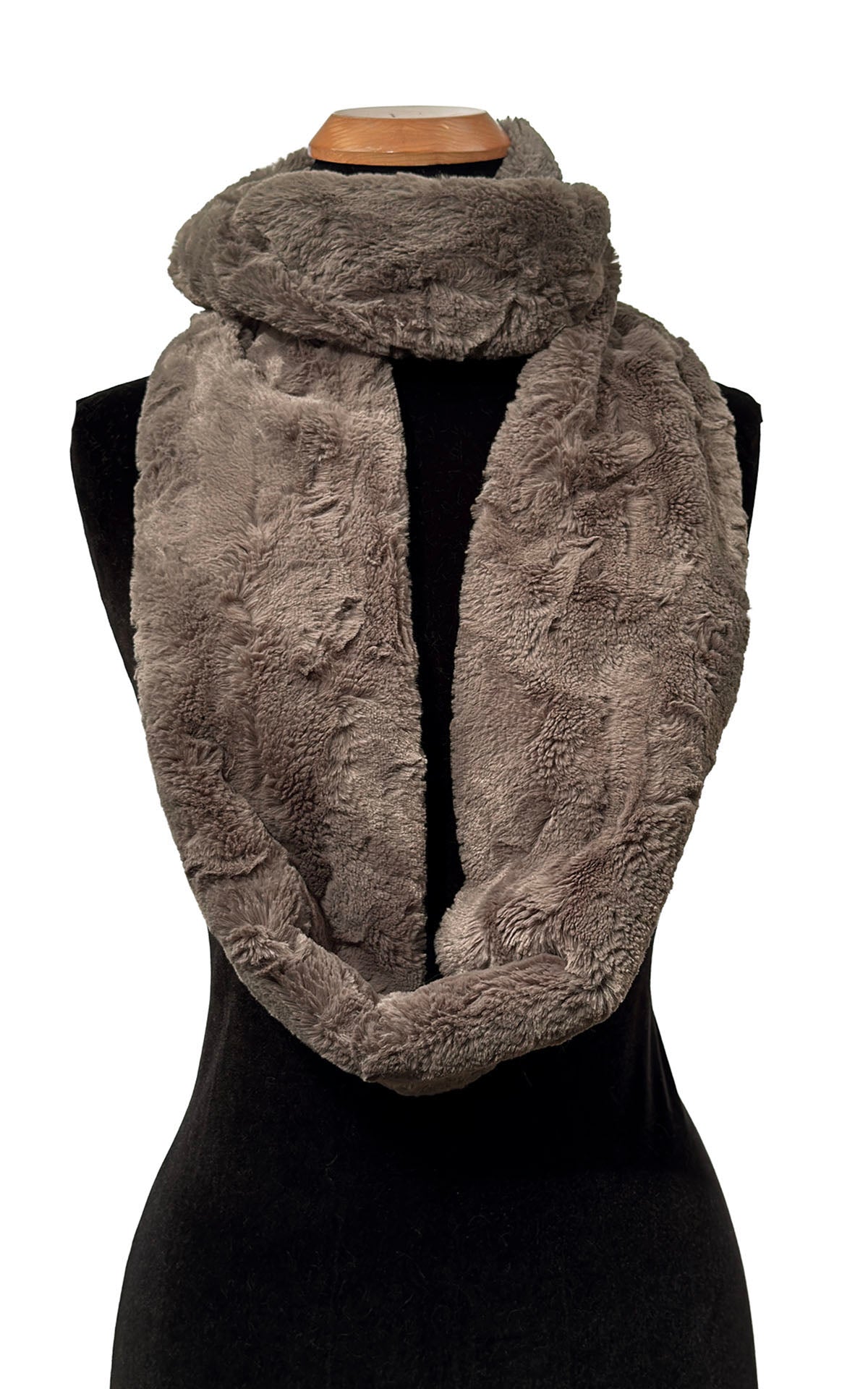 Infinity Scarf in Cuddly Taupey Faux Fur, shown with one loop closer to the neck and remaining loop draped loosely across body of mannequin. Made in Seattle, WA, USA by Pandemonium Seattle.