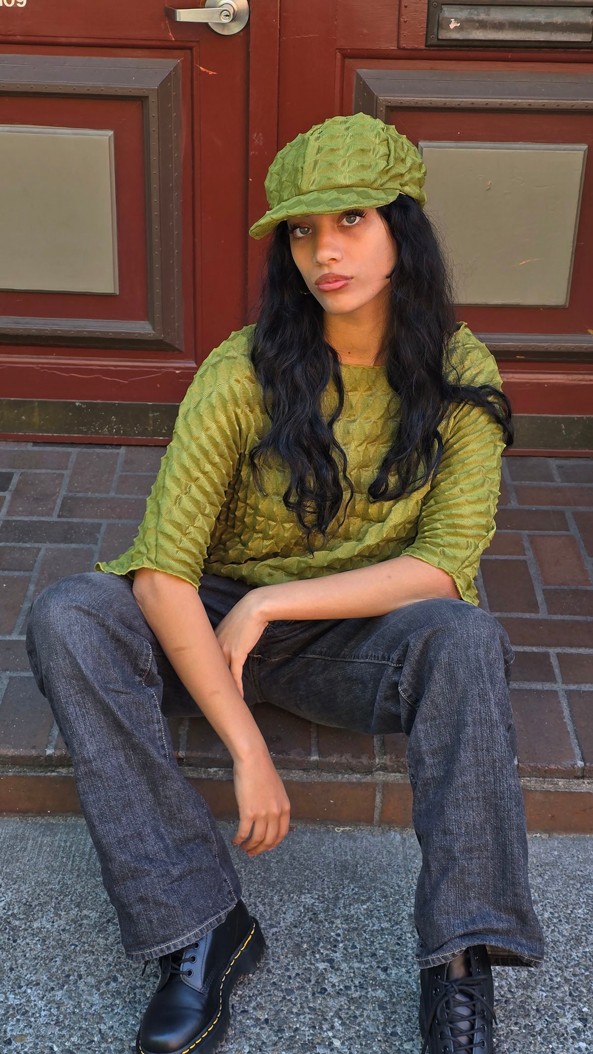 Woman wearing the LYC Fractal Bat Wing Top in Avocado and the matching Dianne Cap. Made in Seattle, WA, USA by LYC/Pandemonium Seattle.