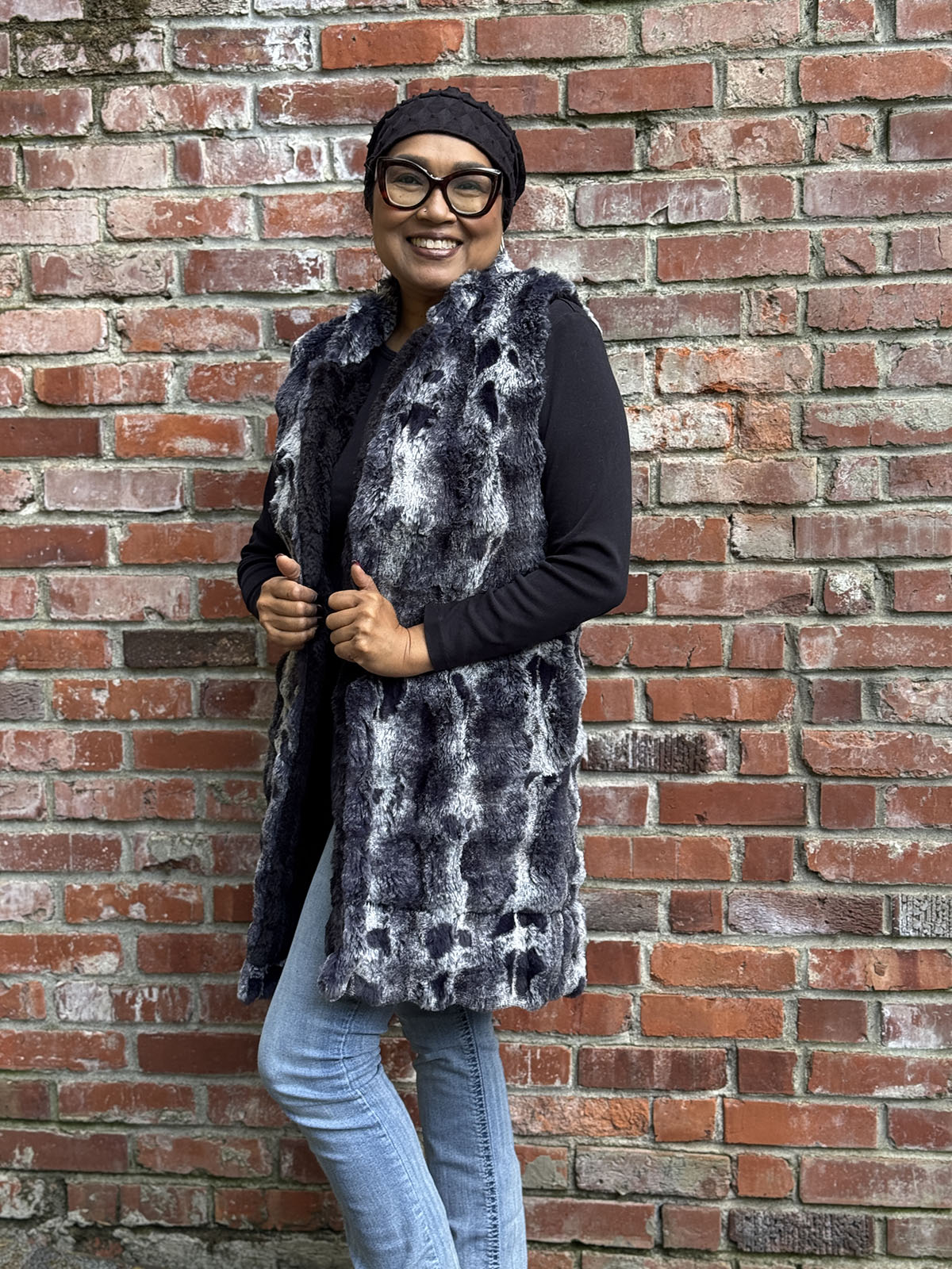 Woman wearing the Mandarin Vest in Cloudwalk in Shadow with reversible Cirrus in Shadow. Hand sewn in Seattle, WA by Pandemonium Seattle.