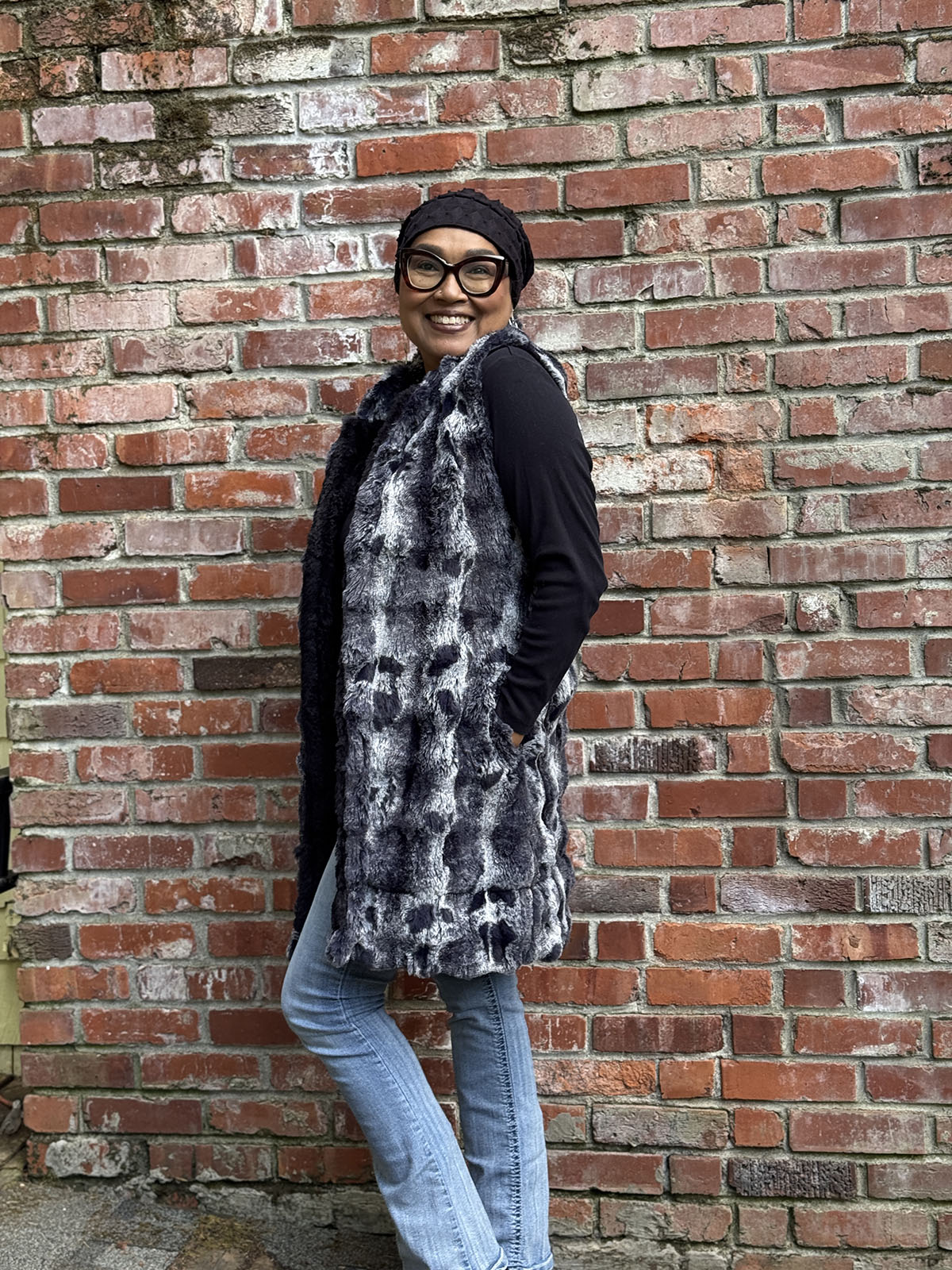 Side view of woman wearing the Mandarin Vest in Cloudwalk in Shadow with reversible Cirrus in Shadow. Hand sewn in Seattle, WA by Pandemonium Seattle.