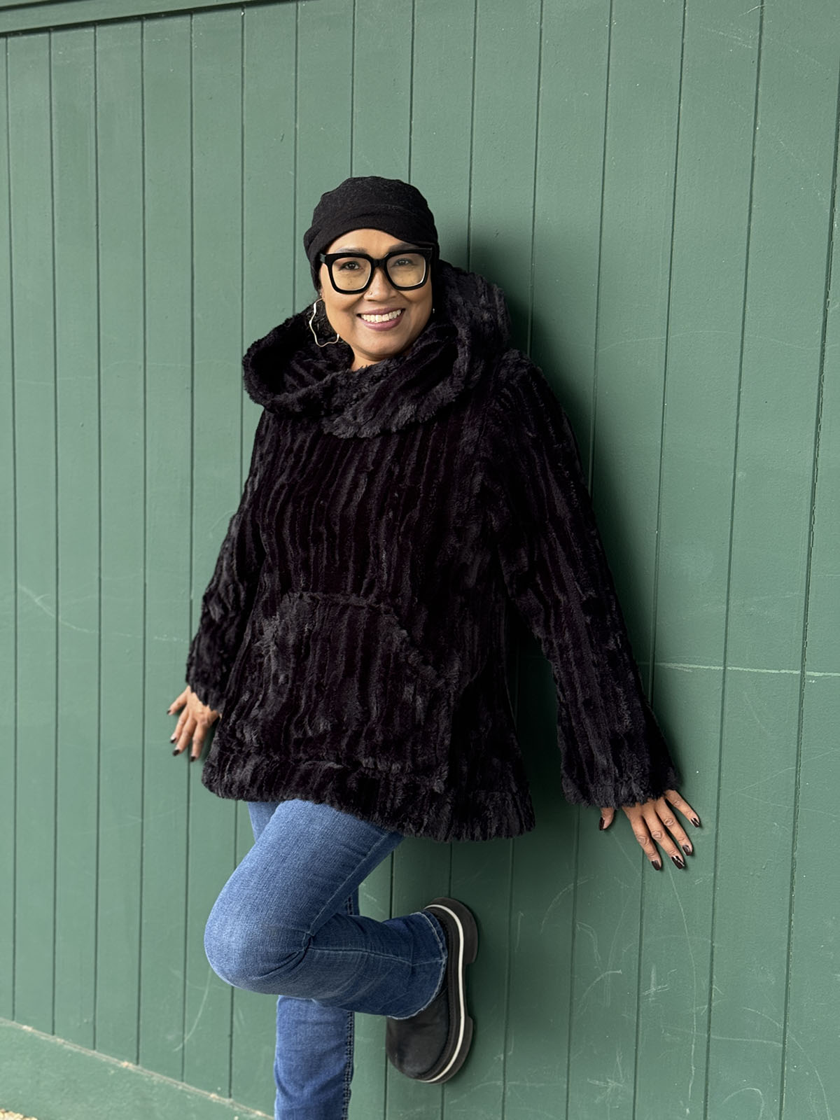 Woman wearing the Hooded Lounger in Cirrus in Shadow with the hood down. Hand sewn in Seattle, WA by Pandemonium Seattle.