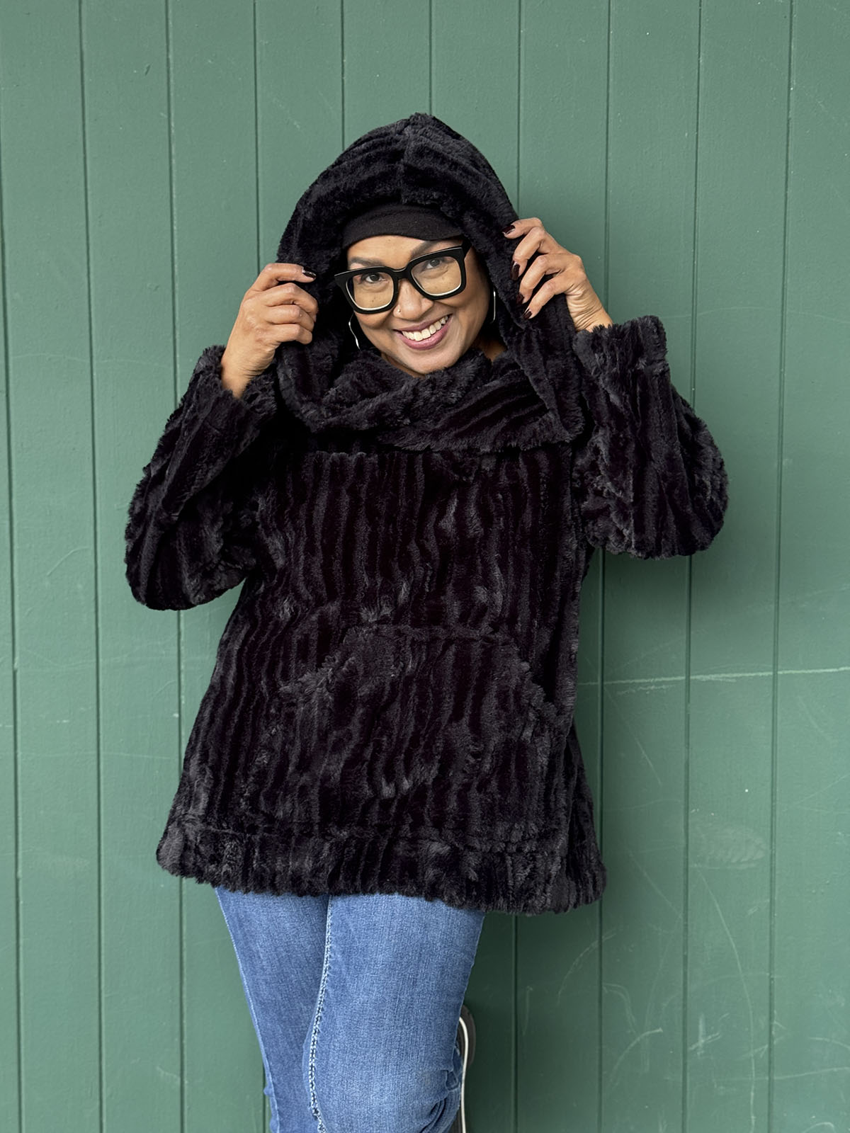 Woman wearing the Hooded Lounger in Cirrus in Shadow with the hood up. Hand sewn in Seattle, WA by Pandemonium Seattle.