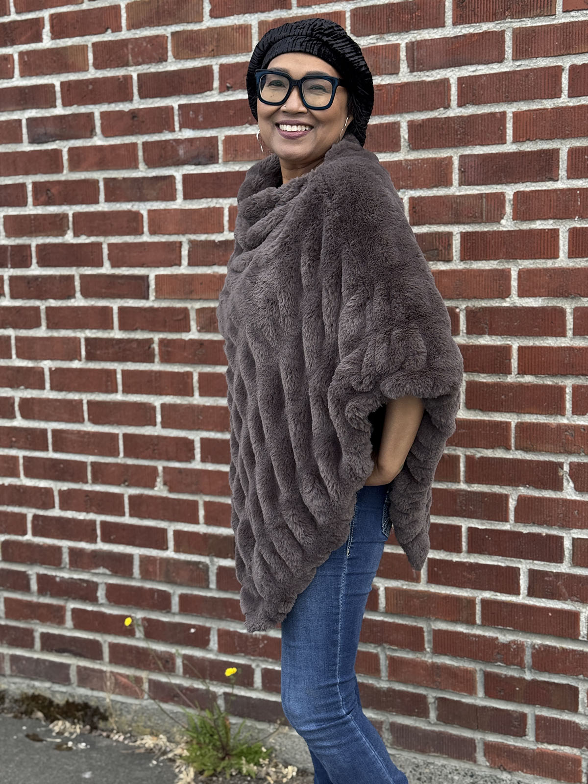 Woman wearing the Royal Opulence Poncho in Mink Grey. Made in Seattle, WA, USA by Pandemonium Millinery.