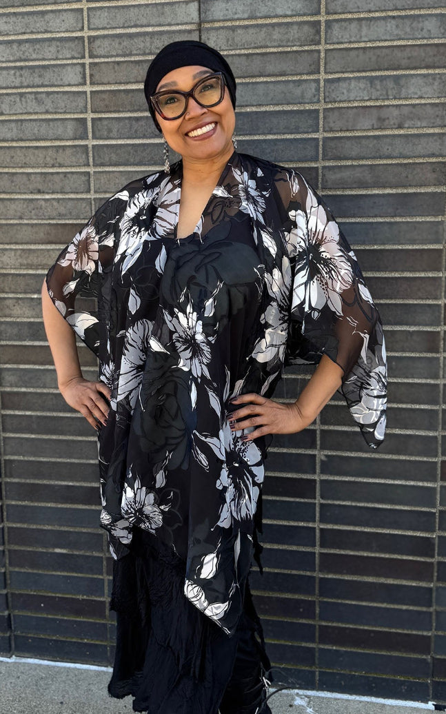Woman wearing the Lumina Poncho in Leading Lady, shown styled as a V-Neck Poncho. Made in Seattle, WA, USA by Pandemonium Seattle.