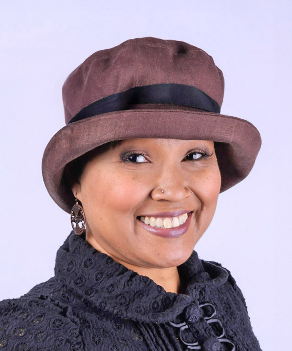 Woman wearing Molly Bucket Style Hat in Chocolate Linen with Black Band | Handmade By Pandemonium Millinery in Seattle WA