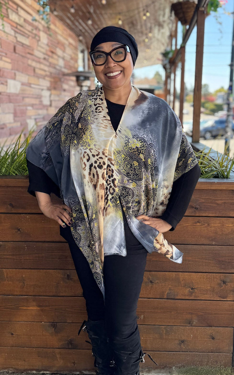 Woman wearing the Lumina Poncho in Party Animal, shown with V-Neck styling. Made in Seattle, WA, USA by Pandemonium Seattle.