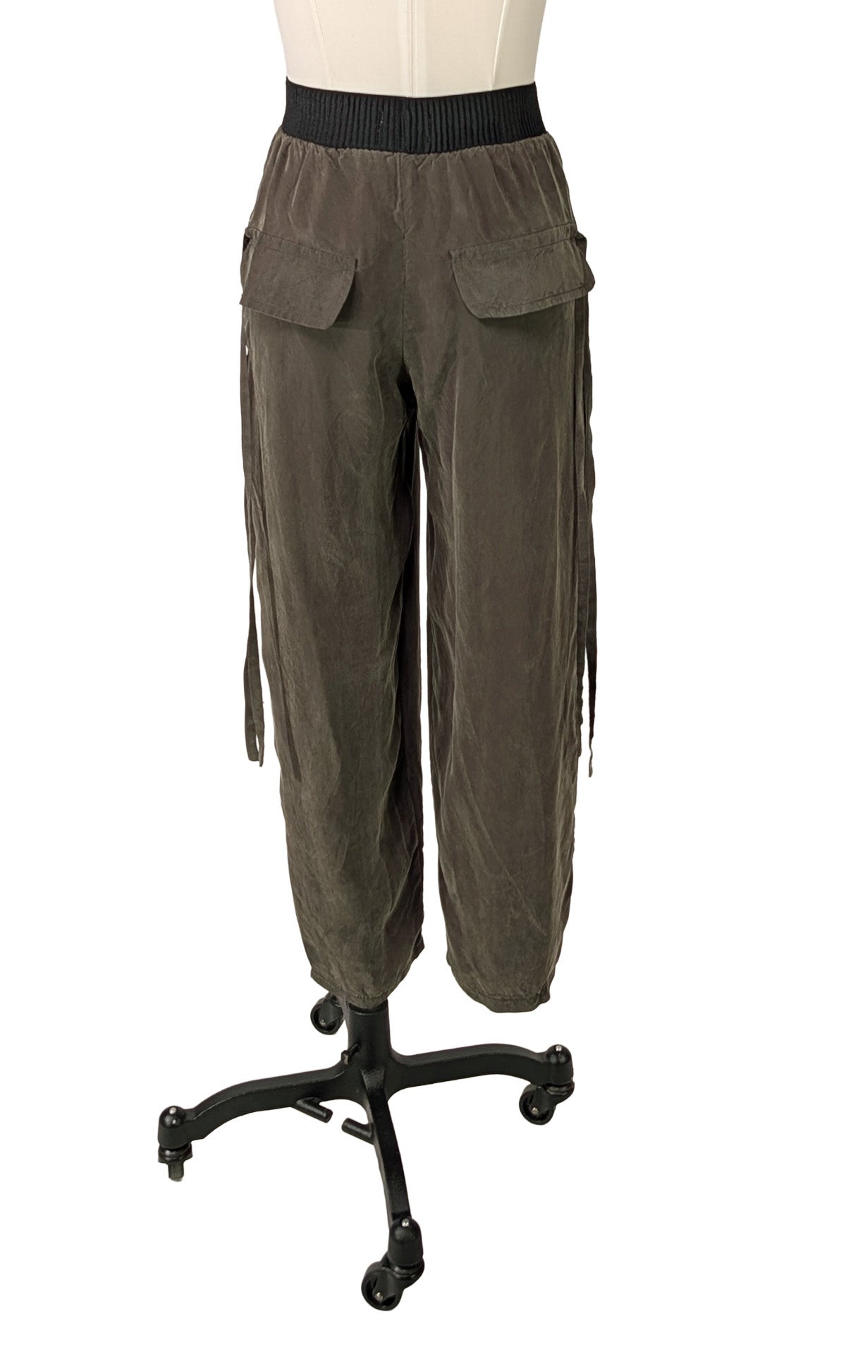 Dusk Olive Green Pleated Ankle Jogger Pants shown from the back view. Made in Seattle, WA, USA by Pandemonium Seattle.