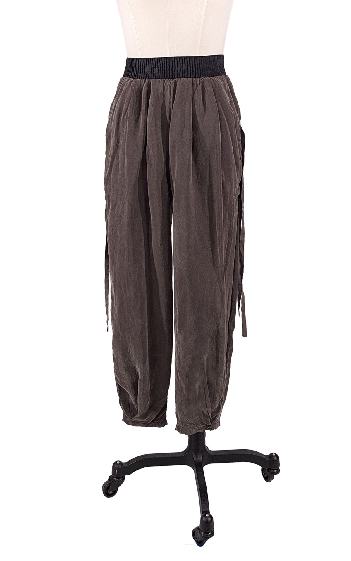 Dusk Olive Green Pleated Ankle Jogger Pants shown from the front view. Made in Seattle, WA, USA by Pandemonium Seattle.