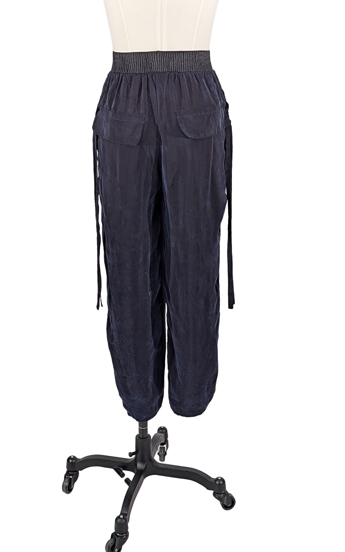 Dark navy blue Inkwell Pleated Ankle Jogger Pants shown from the back view. Made in Seattle, WA, USA by Pandemonium Seattle.