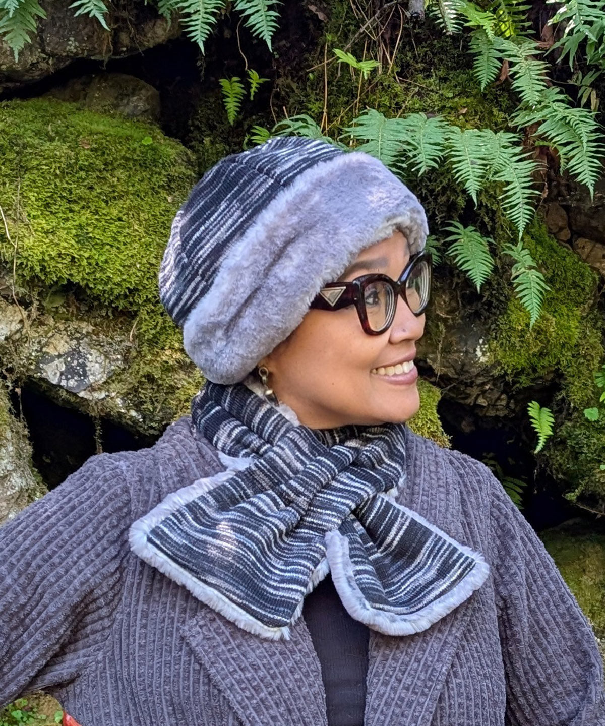 Woman wearing a Beanie Hat in Sweet Stripes Blackberry Cobbler and Olympic Fog viewed in profile. Made in Seattle, WA, USA by Pandemonium Seattle.