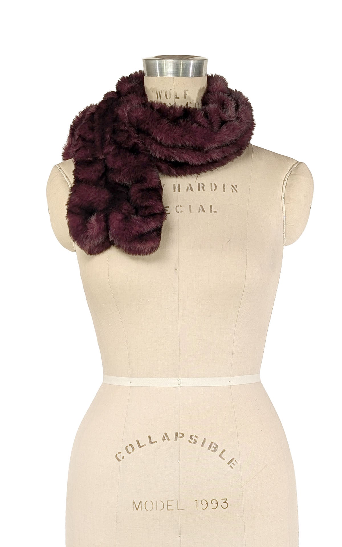 Pull Thru Scarf shown in Royal Opulence Cherry Bomb Faux Fur. Styled on a mannequin in a bow look.  Handsewn in Seattle, WA, USA by Pandemonium Seattle
