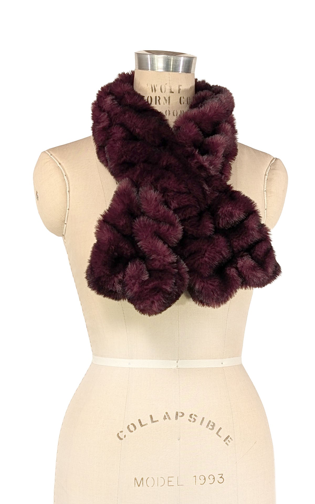 Pull Thru Scarf shown in Royal Opulence Cherry Bomb Faux Fur. Styled on a mannequin in a bow look.  Handsewn in Seattle, WA, USA by Pandemonium Seattle