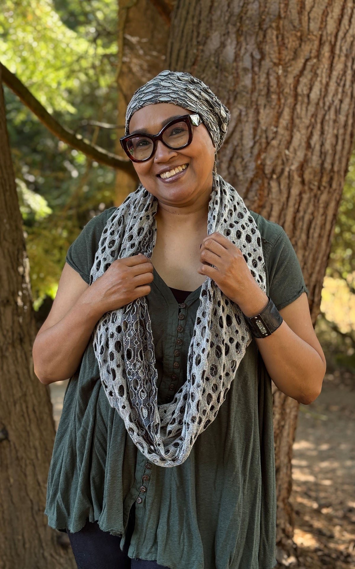 Woman wearing the Lunar Landing Infinity Scarf and Rowdie Hat in  Lunar Landing. Handmade in Seattle, WA, USA by Pandemonium Seattle.