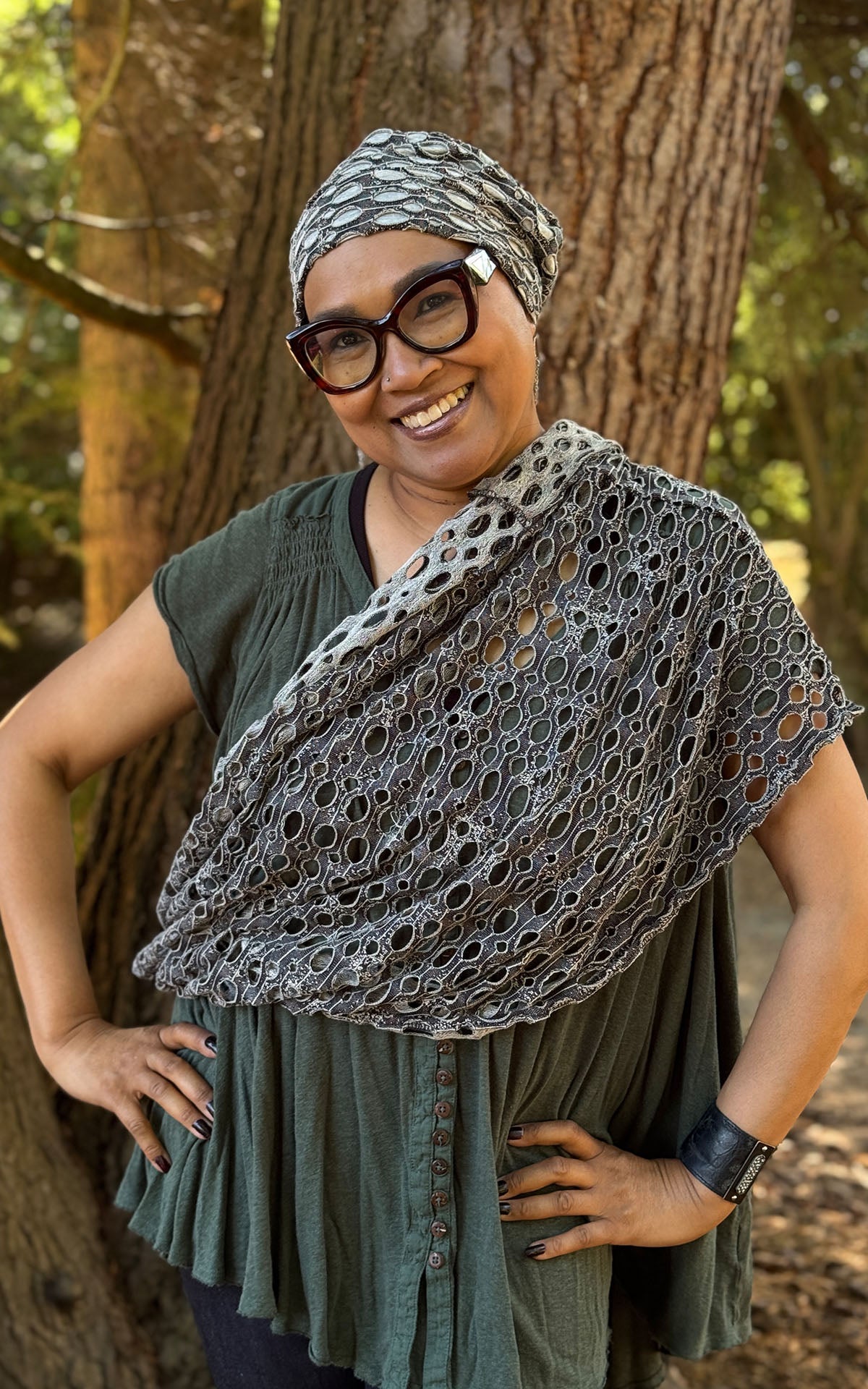 Woman wearing the wide Lunar Landing Infinity Scarf cross-body style. Also wearing the Rowdie Hat in Lunar Landing. Made in Seattle, WA, USA by Pandemonium Millinery.