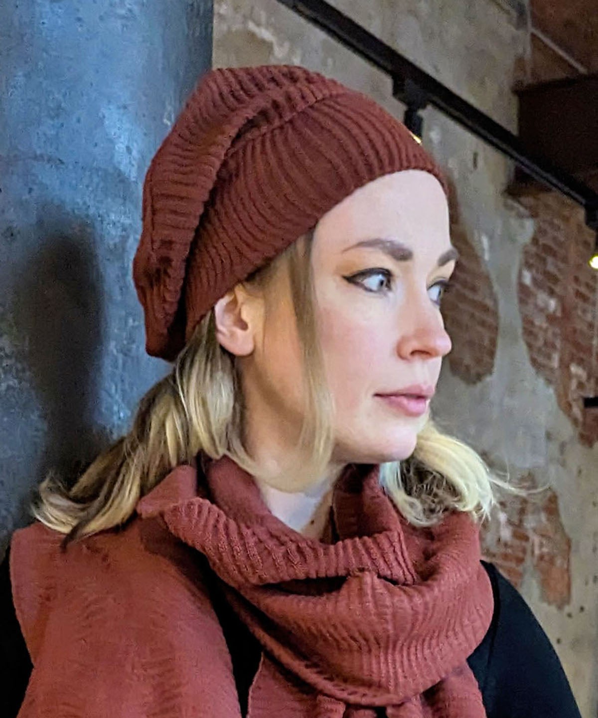 Rowdie Hat in Burnt Sienna, shown on model. LYC by Pandemonium is handmade by Pandemonium Seattle.