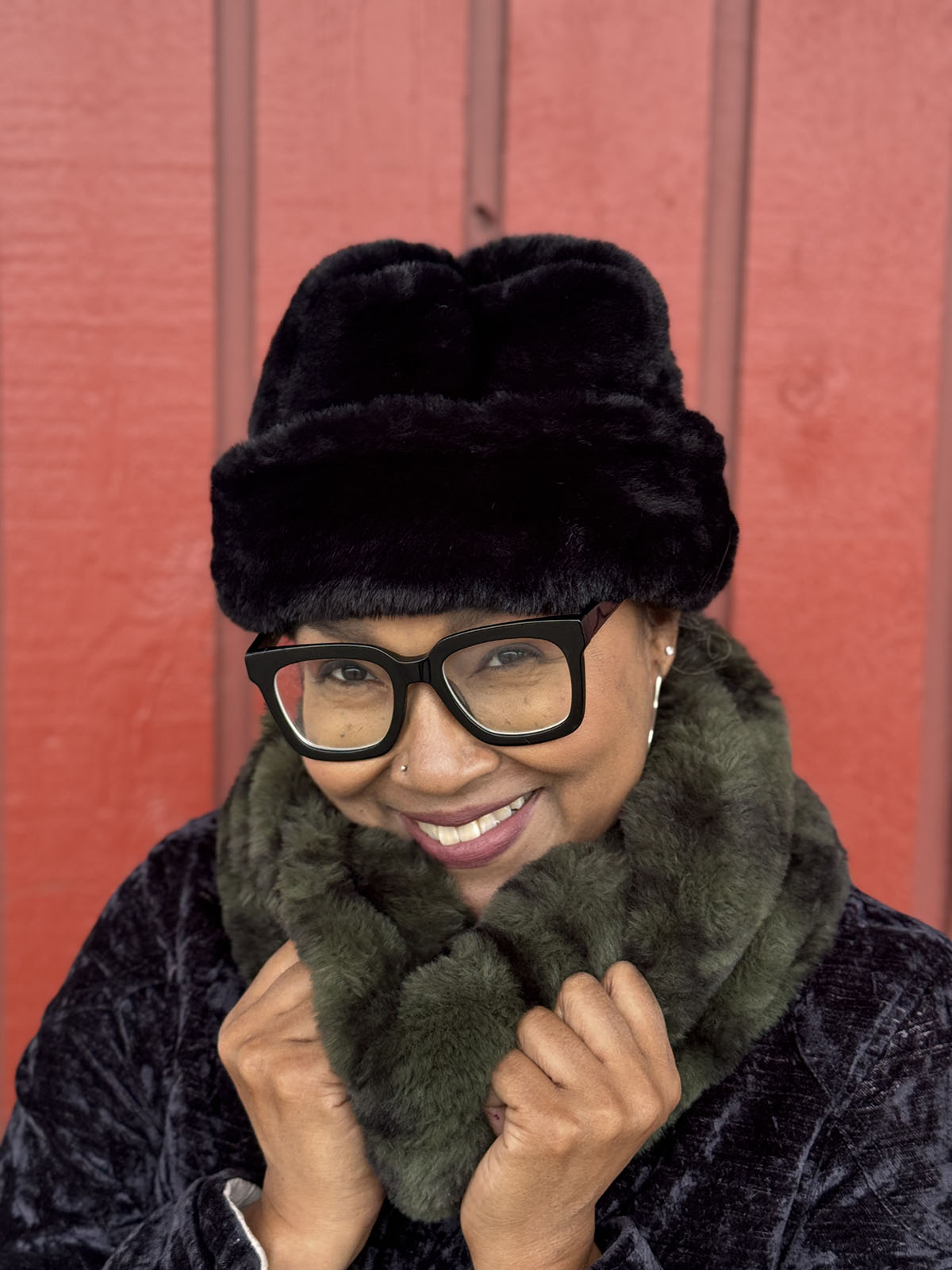 Woman wearing the Royal Opulence Neck Warmer in Black Pine with a Royal Opulence Beanie in Onyx. Handmade in Seattle, Washington by Pandemonium Seattle.
