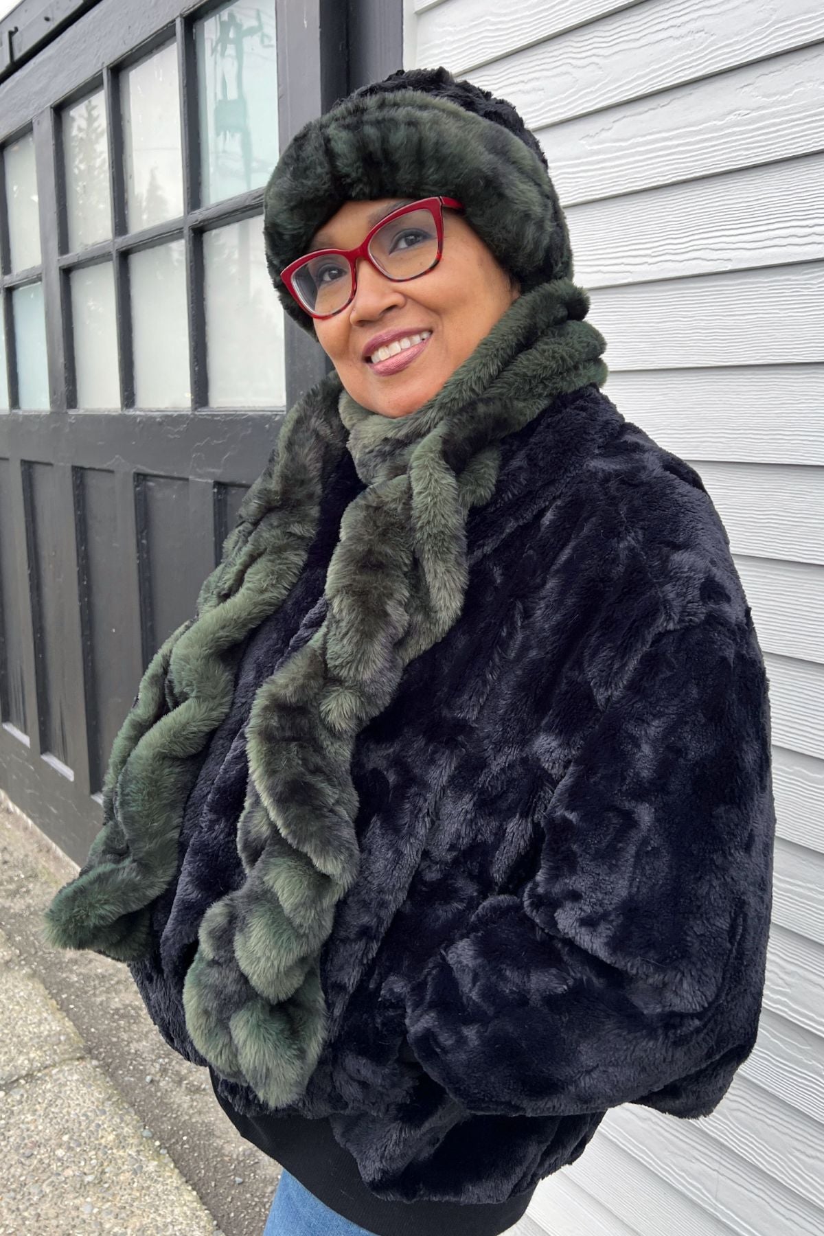 Model is wearing a Royal Opulence Black Pine Faux Fur Scarf with Cuffed Pillbox in Black Pine with Cuddly Black Faux Fur by Pandemonium Seattle. Handmade in Seattle, WA USA.