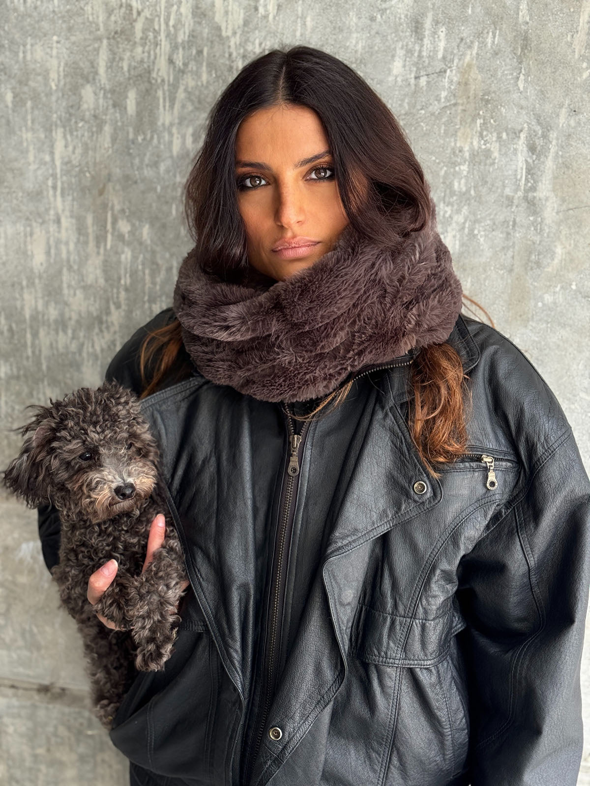 Woman wearing the Royal Opulence Neck Warmer in Mink Grey, while holding her poodle puppy. Handmade in Seattle, Washington by Pandemonium Seattle.
