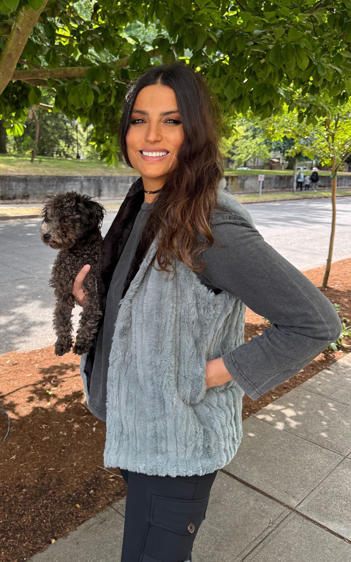 Woman wearing the Shawl Collar Vest in Cirrus Blue Mist with reversible Cuddly Black faux fur. Hand sewn in Seattle, Washington by Pandemonium Seattle.
