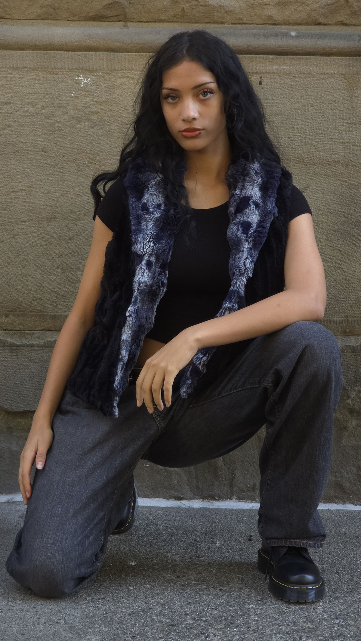 Woman wearing the Shawl Collar Vest in Cloudwalk Shadow, reversed to display the Cuddly Black side. Made in Seattle, WA, USA by Pandemonium Seattle.