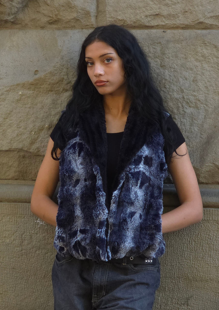 Woman wearing the Cloudwalk Shadow Shawl Collar Vest with single hook closure. Made in Seattle, WA, USA by Pandemonium Seattle.
