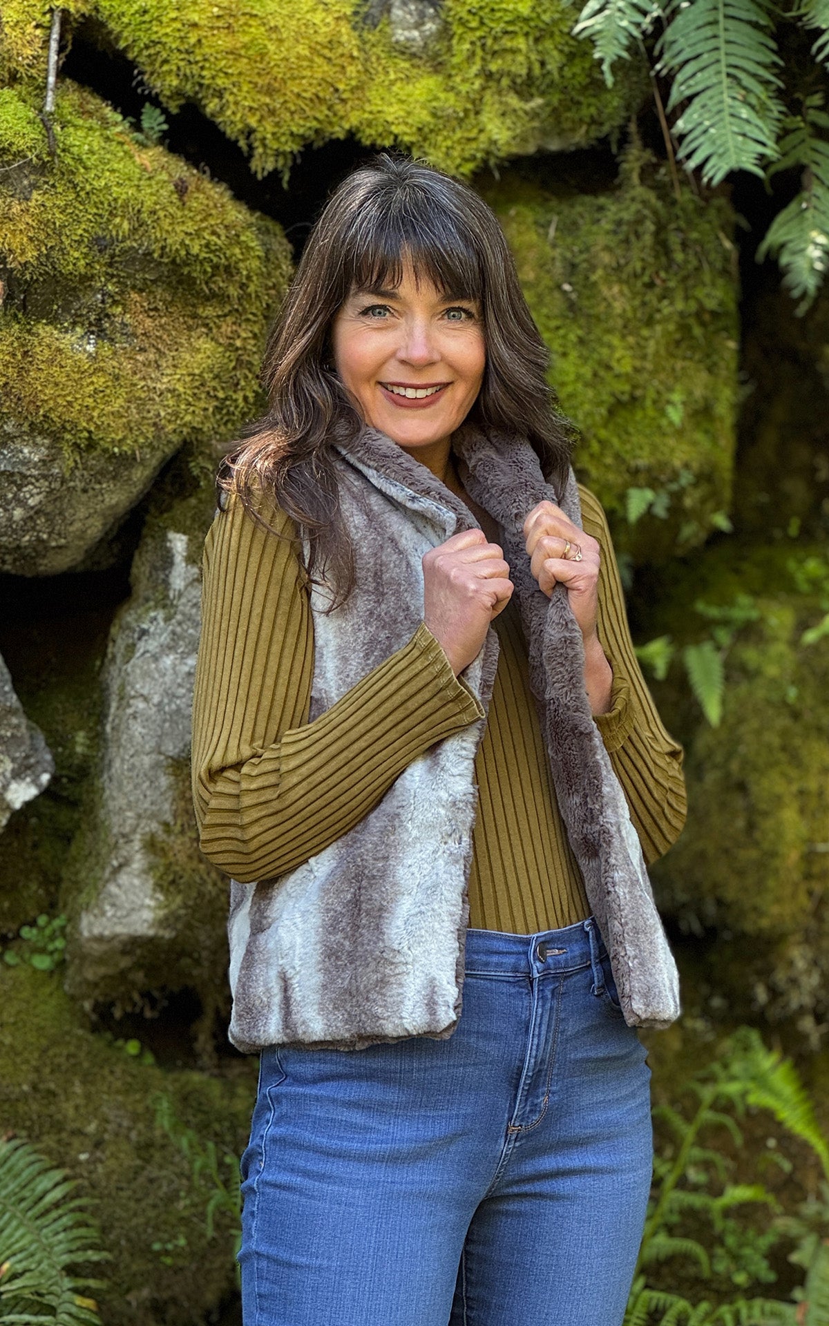 Woman wearing the Shawl Collar Vest in Driftwood Luxury Faux Fur with reversible Cuddly Taupey Faux Fur. Made in Seattle, WA, USA by Pandemonium Seattle.