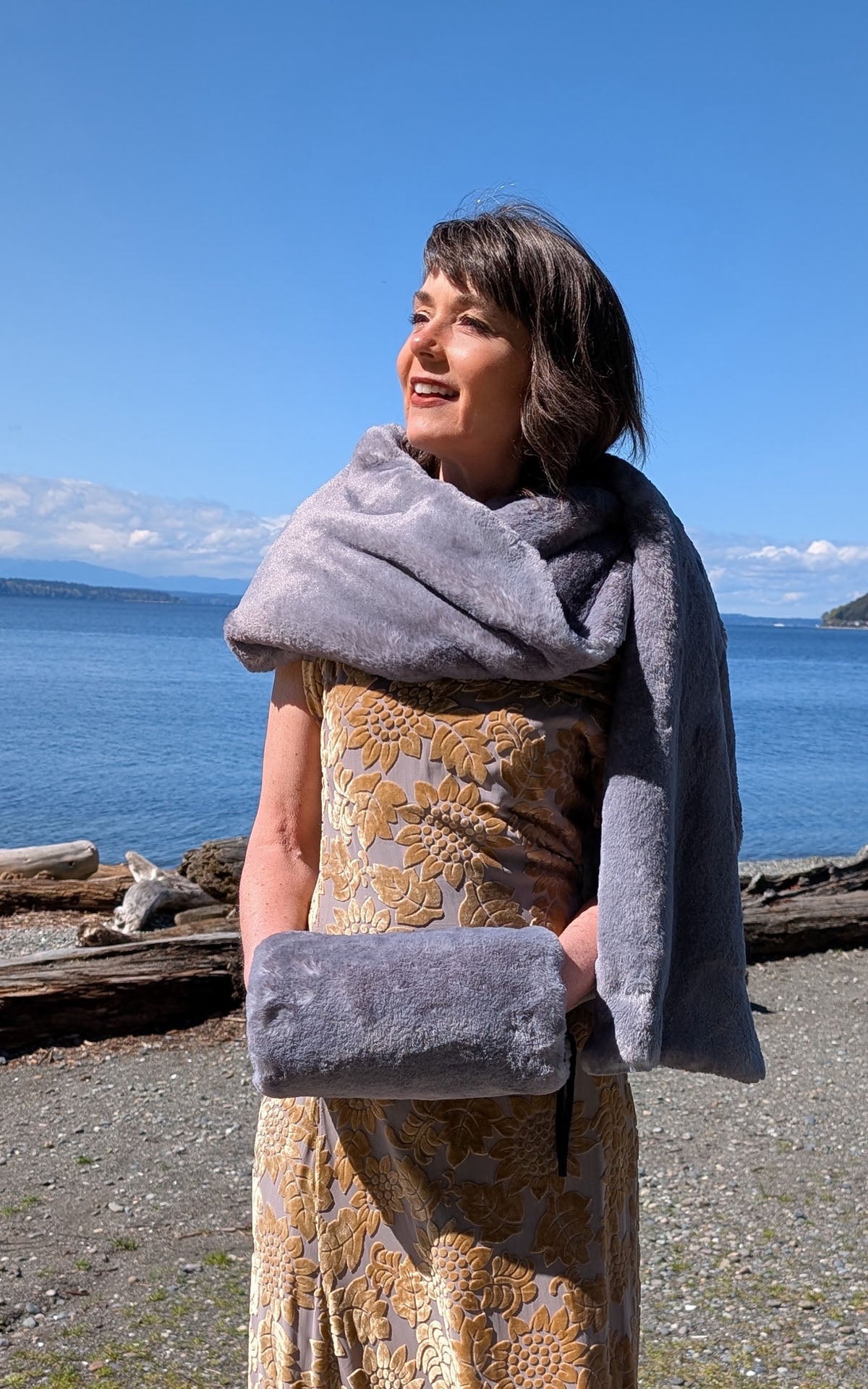 Woman wearing the Muff in Coastal Plush Olympic Fog with the matching Stole in Olympic Fog. Made in Seattle, WA, USA by Pandemonium Seattle.