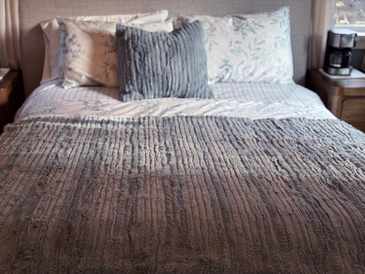 Bed with Throw in Cirrus Blue Mist with Matching Pillow Sham in Cirrus Blue Mist. Made in Seattle, WA, USA by Pandemonium Millinery.