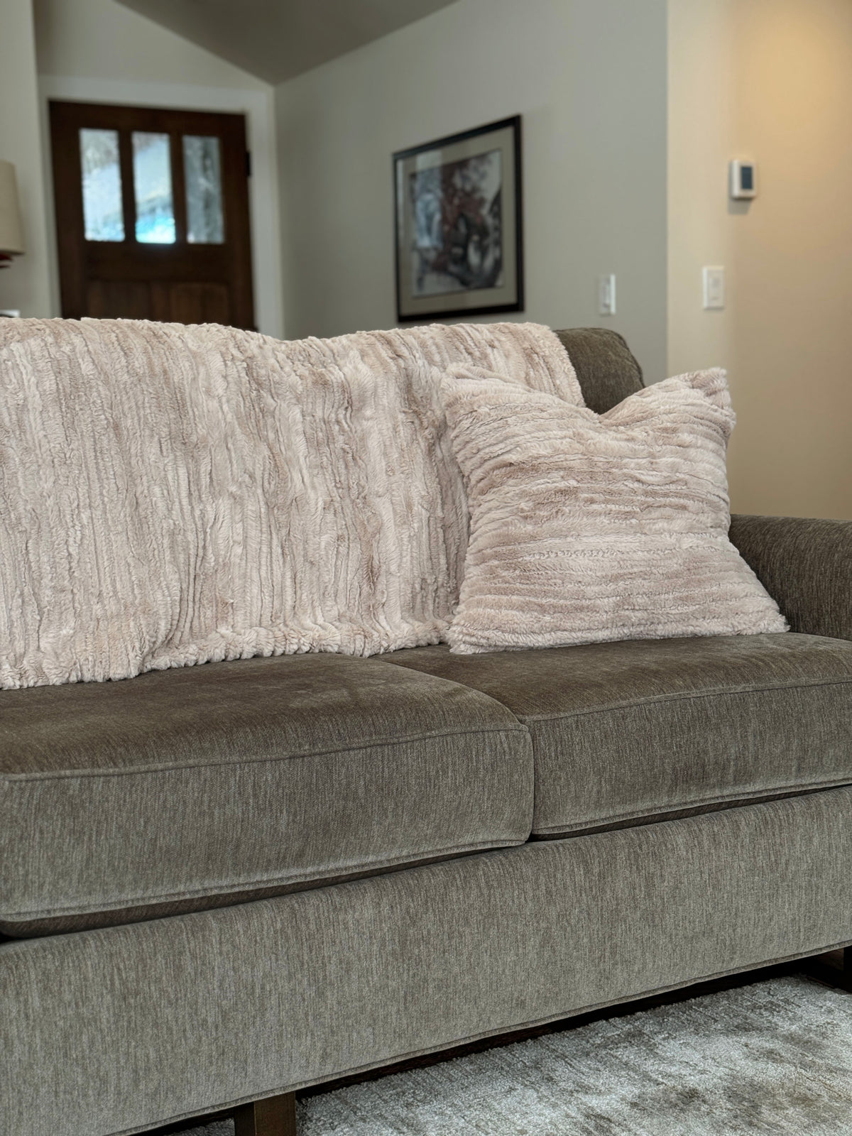 Sofa with Throw in Cirrus Honey and matching Pillow Sham in Cirrus Honey. Made in Seattle, WA, USA by Pandemonium Millinery.