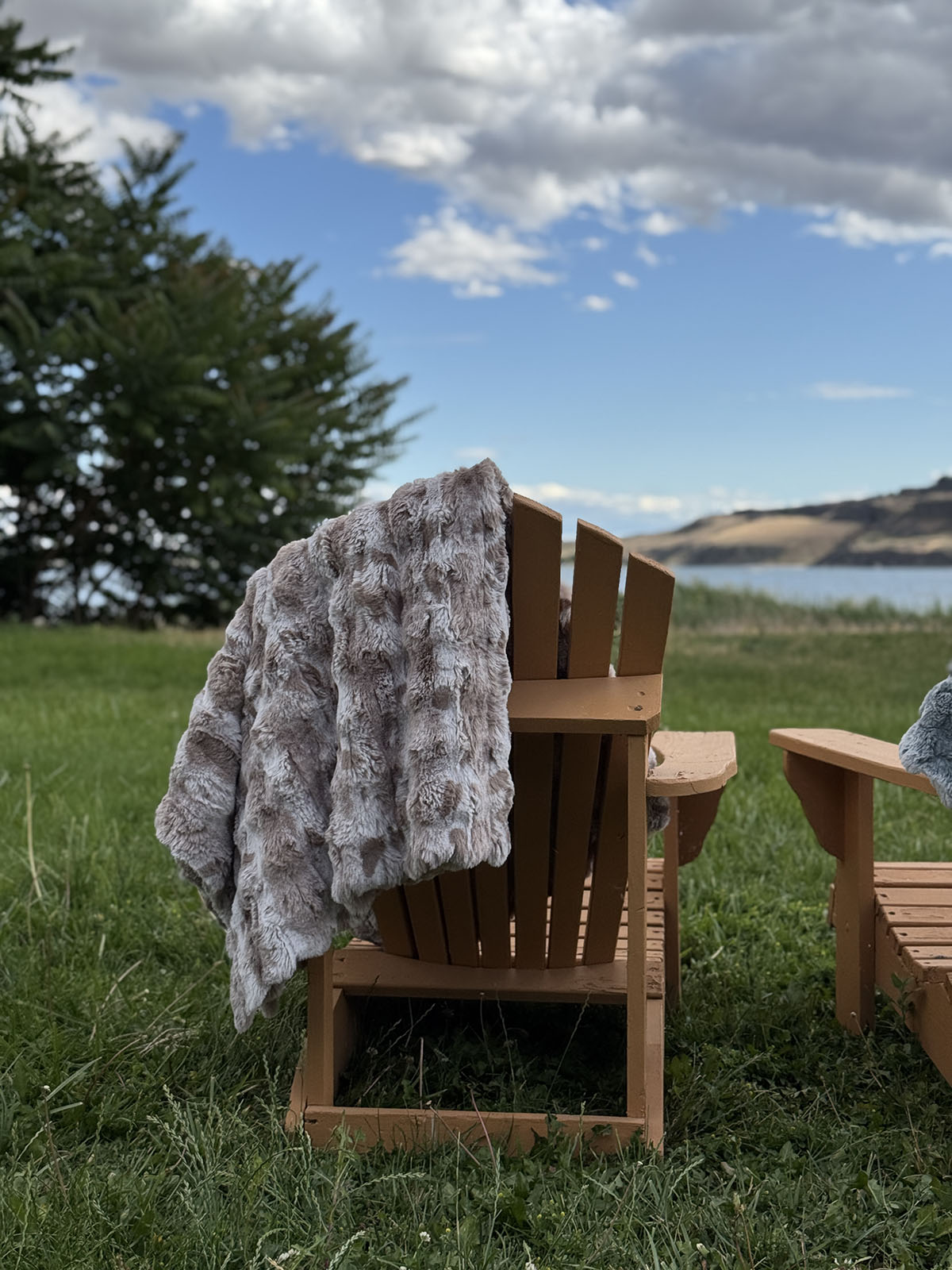 Throw blanket in Cloudwalk Honey, draped over a chair. Made in Seattle, WA, USA by Pandemonium Seattle.