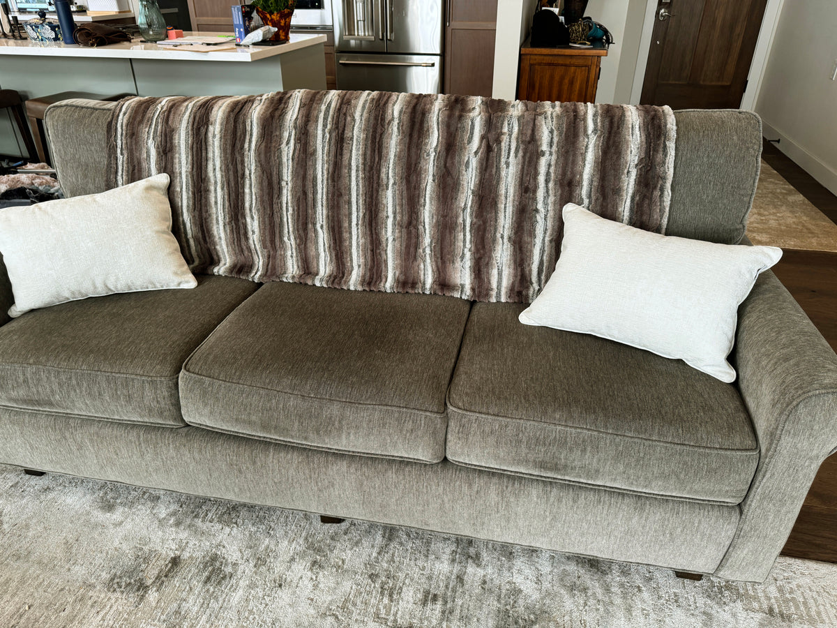 Willows Grove Throw across the back of a sofa. Made in Seattle, WA, USA by Pandemonium Millinery.