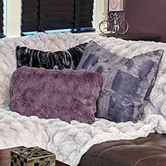 purple and black pillows on cream blanket handmade in USA by Pandemonium Seattle