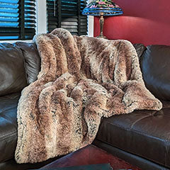 multi-tonal brown tissavel faux fur throw on leather couch handmade by Pandemonium Seattle USA