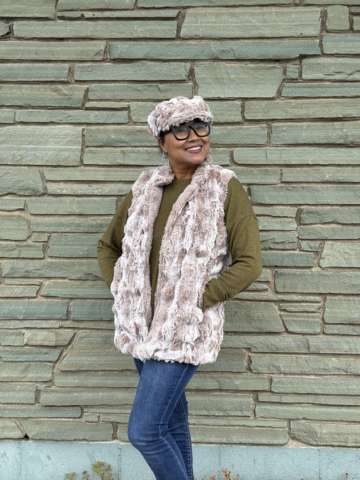 Woman wearing the Mandarin Vest Short style in Cloudwalk in Honey with Cirrus Honey lining. Hand sewn in Seattle, Washington by Pandemonium Seattle.