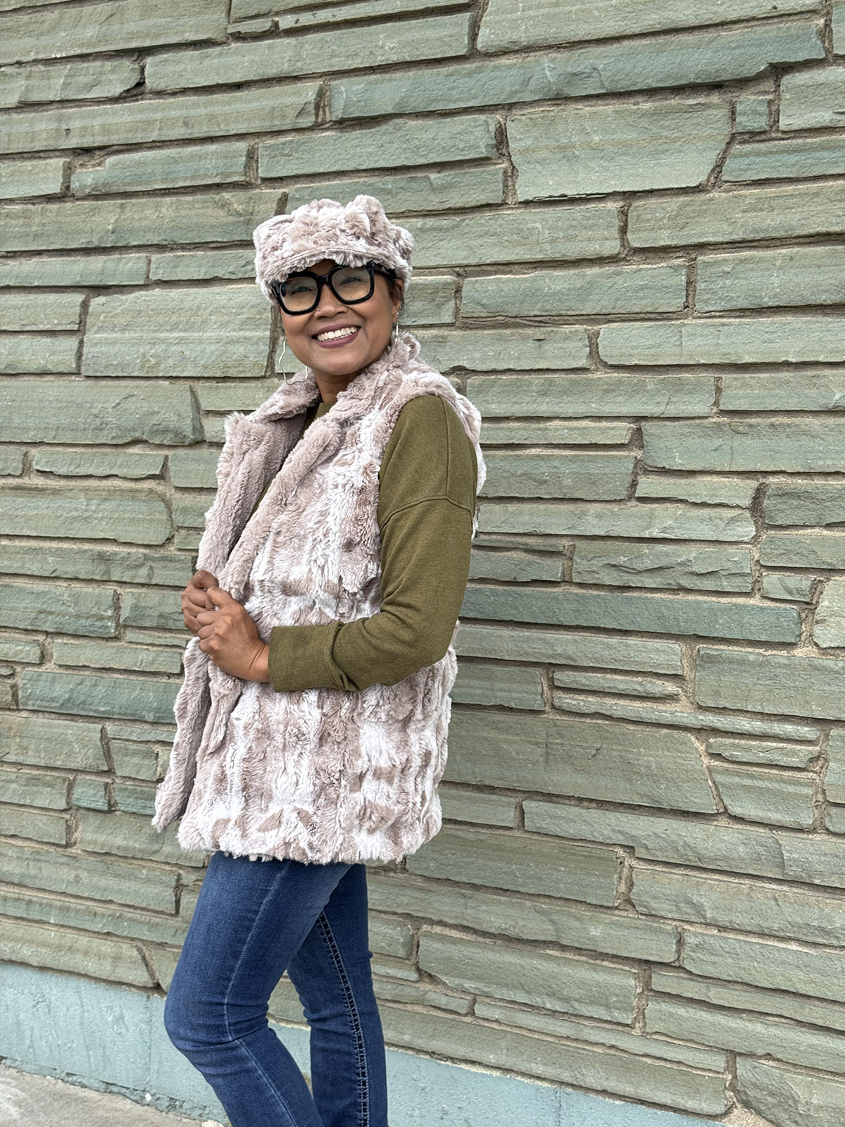 Woman wearing the Mandarin Vest Short style in Cloudwalk Honey with Cirrus Honey lining. Hand sewn in Seattle, Washington by Pandemonium Seattle.