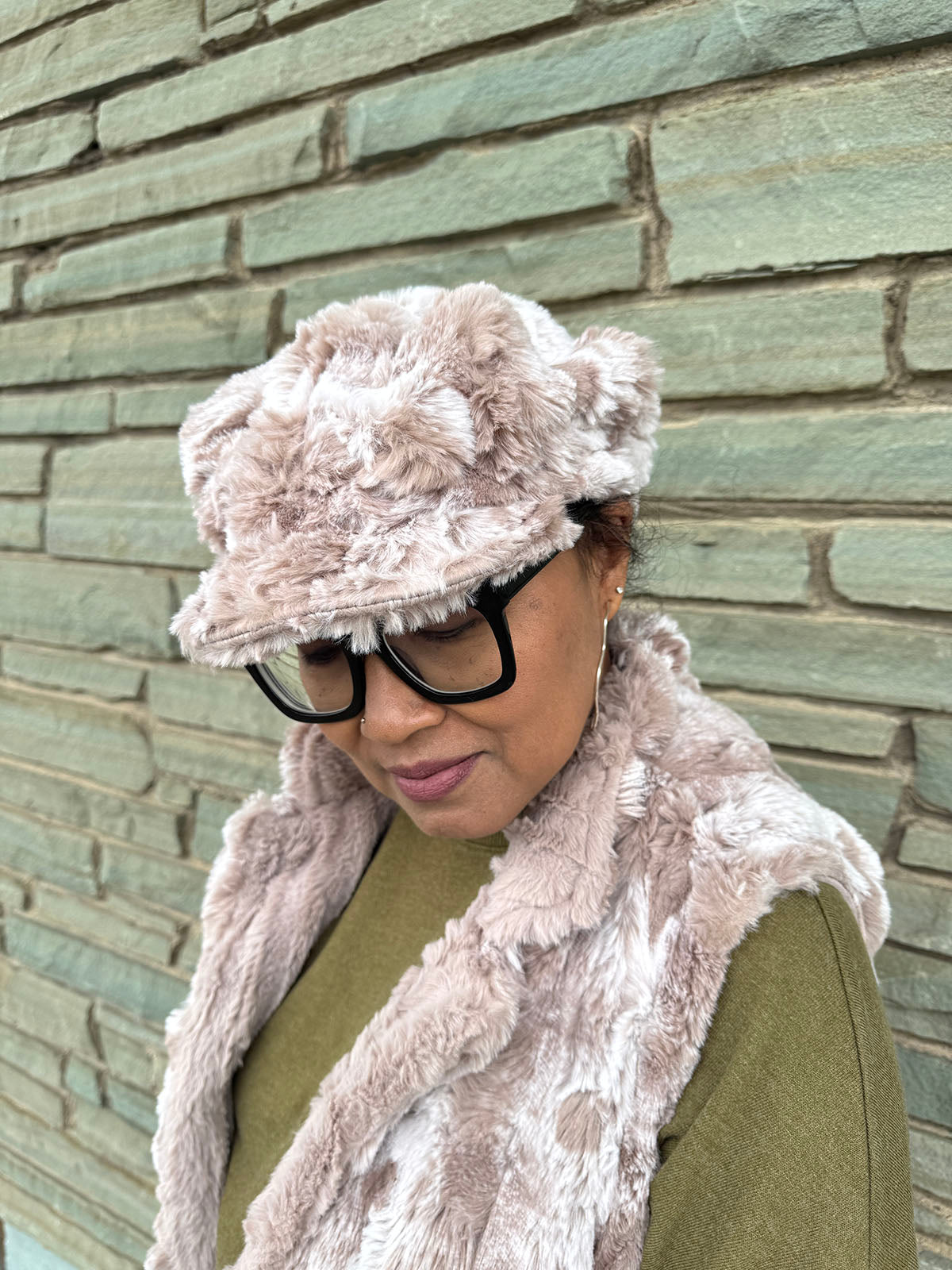 Woman wearing the Valerie Cap in Cloudwalk in Honey faux fur, showing the hat brim. Hand sewn in Seattle, Washington by Pandemonium Seattle.