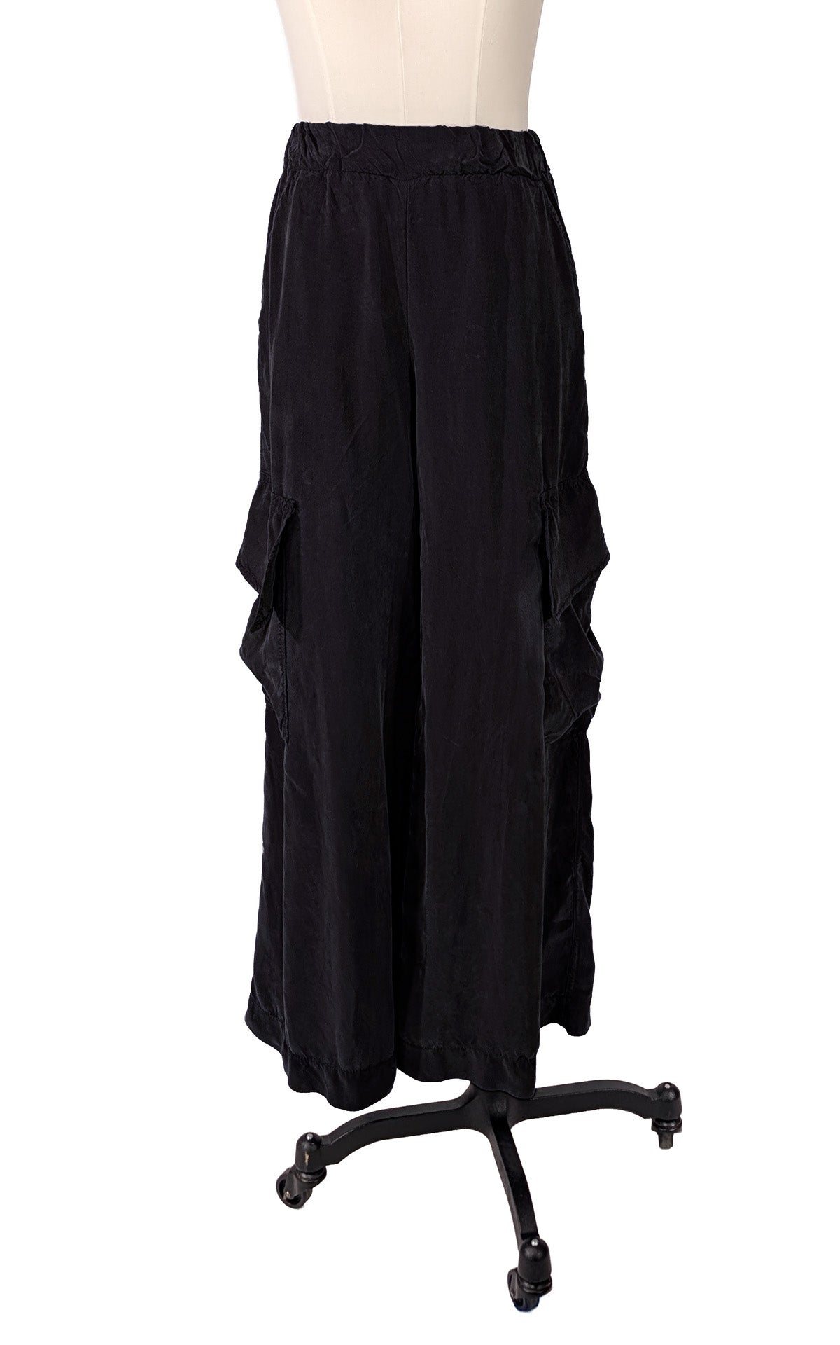 Wide Leg Cargo Pants in Obsidian Black Cupro fabric, shown on a dress form. Made in Seattle, WA, USA by Pandemonium Seattle.