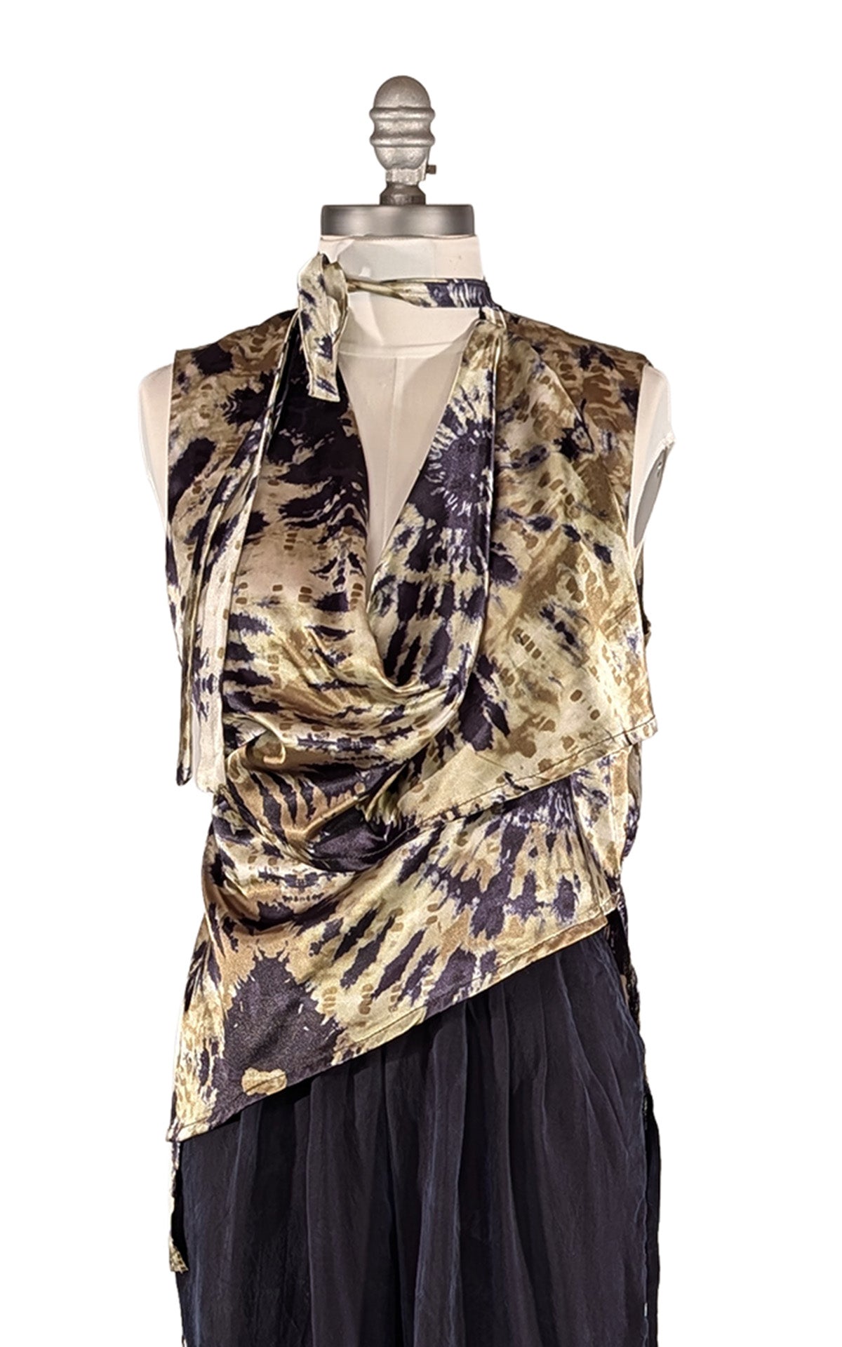 A sleeveless wrap-style top with a tie-dye pattern in greens and black, styled on a mannequin with Inkwell Wide Leg Pleated Pants, against a white background. Made in Seattle, WA by Pandemonium Seattle.