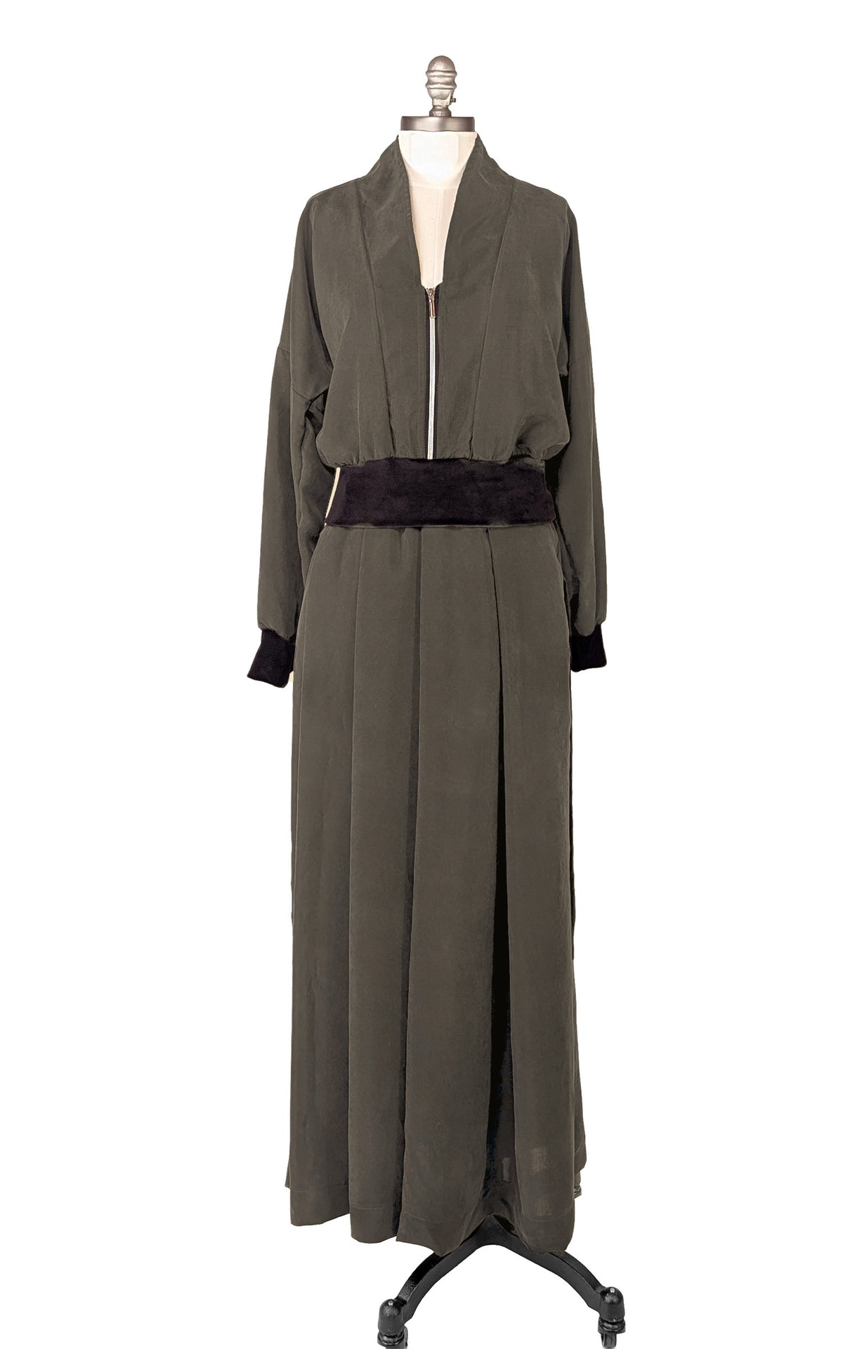 Dusk Olive Green Zipper Jacket shown front view, and the Pleated Skirt in matching Inkwell on a mannequin. Made in Seattle, WA, USA by Pandemonium Seattle.