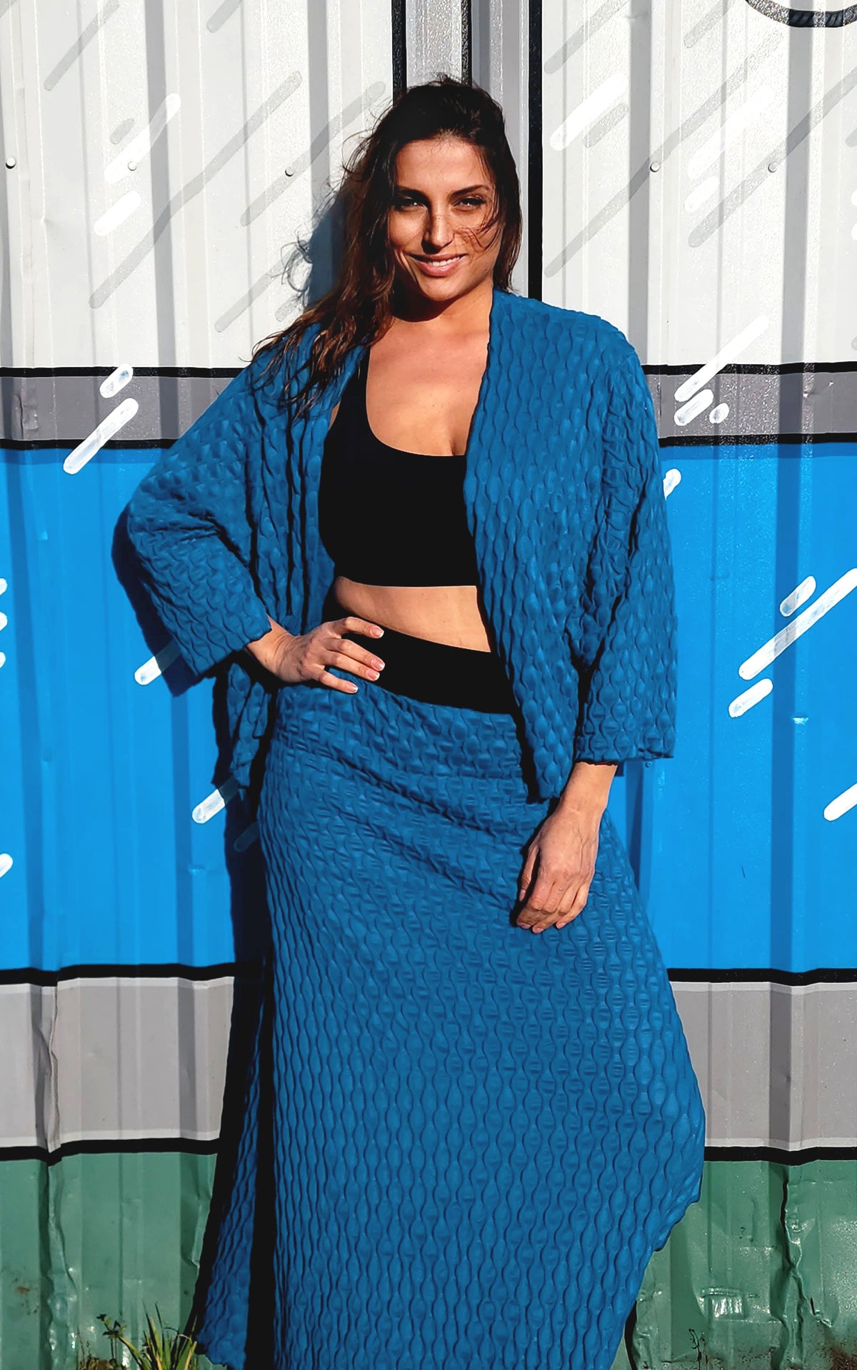 Model in A-Line Skirt and Cardigan in Cerulean Blue, from the LYC/Pandemonium Seattle Fractal Collection. Handmade in Seattle, WA, USA.