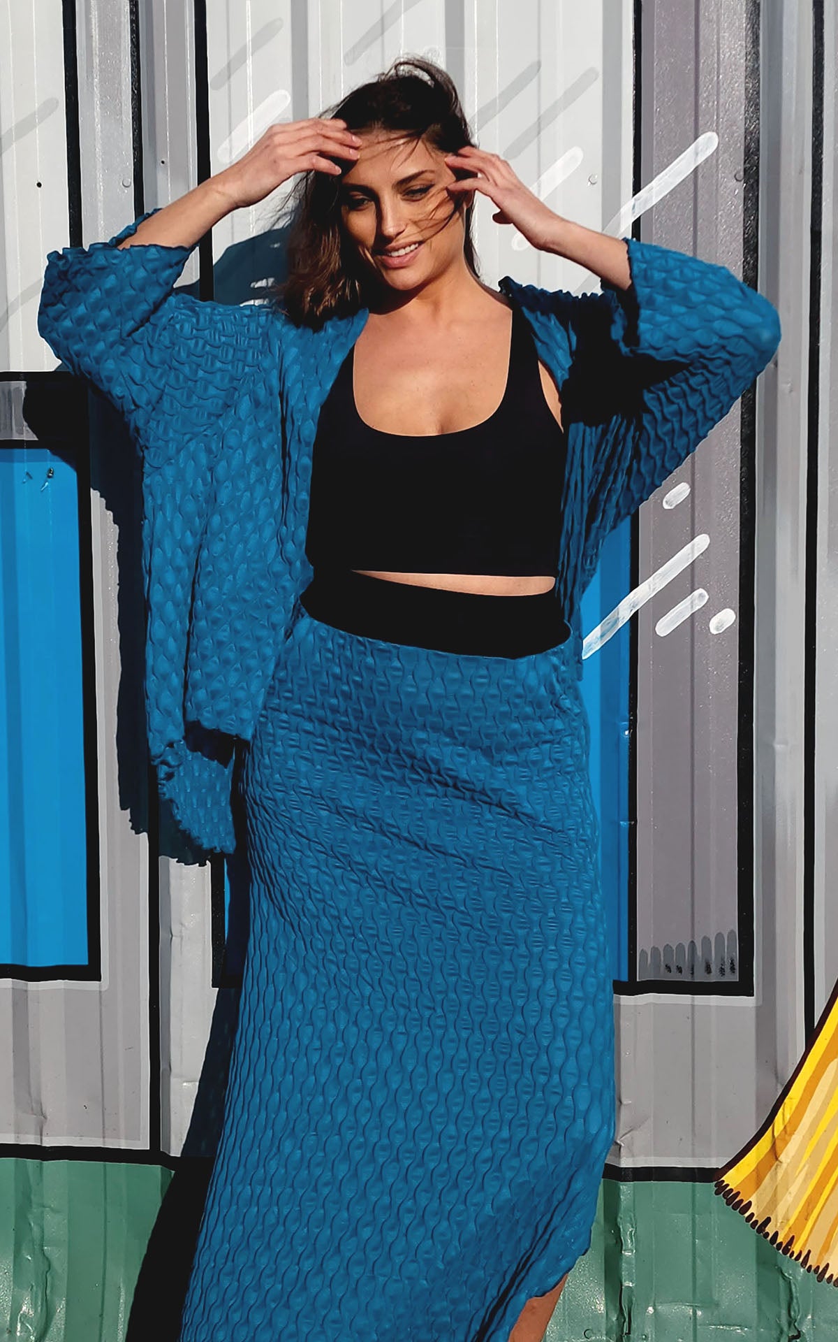 Model photo of the Fractal Collection Cerulean Blue Cardigan and A-line Skirt. LYC by Pandemonium is handmade in Seattle, WA, USA.