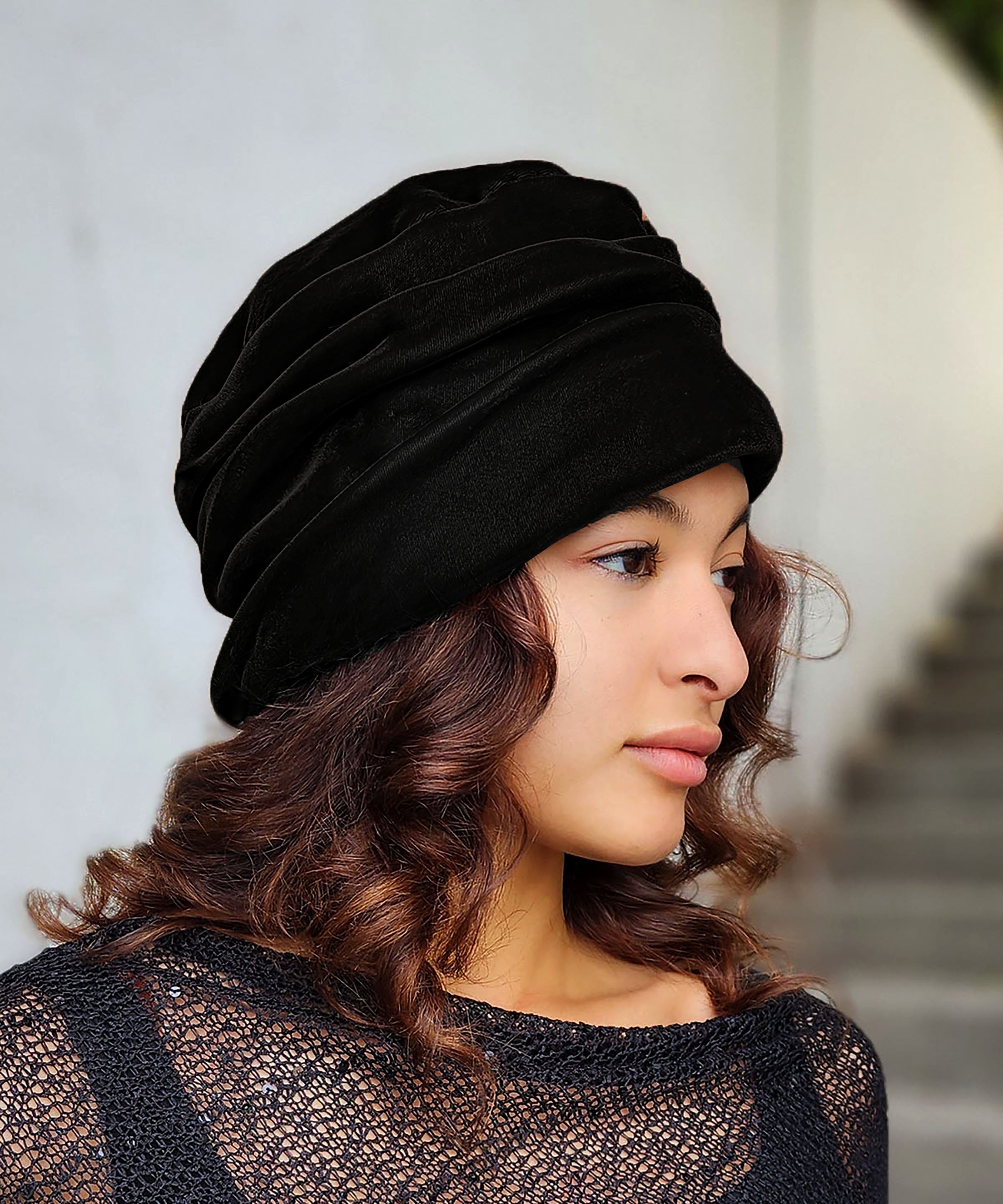 Woman wearing the Ana Cloche Hat in Black Velvet. Made in Seattle, WA, USA by Pandemonium Seattle.