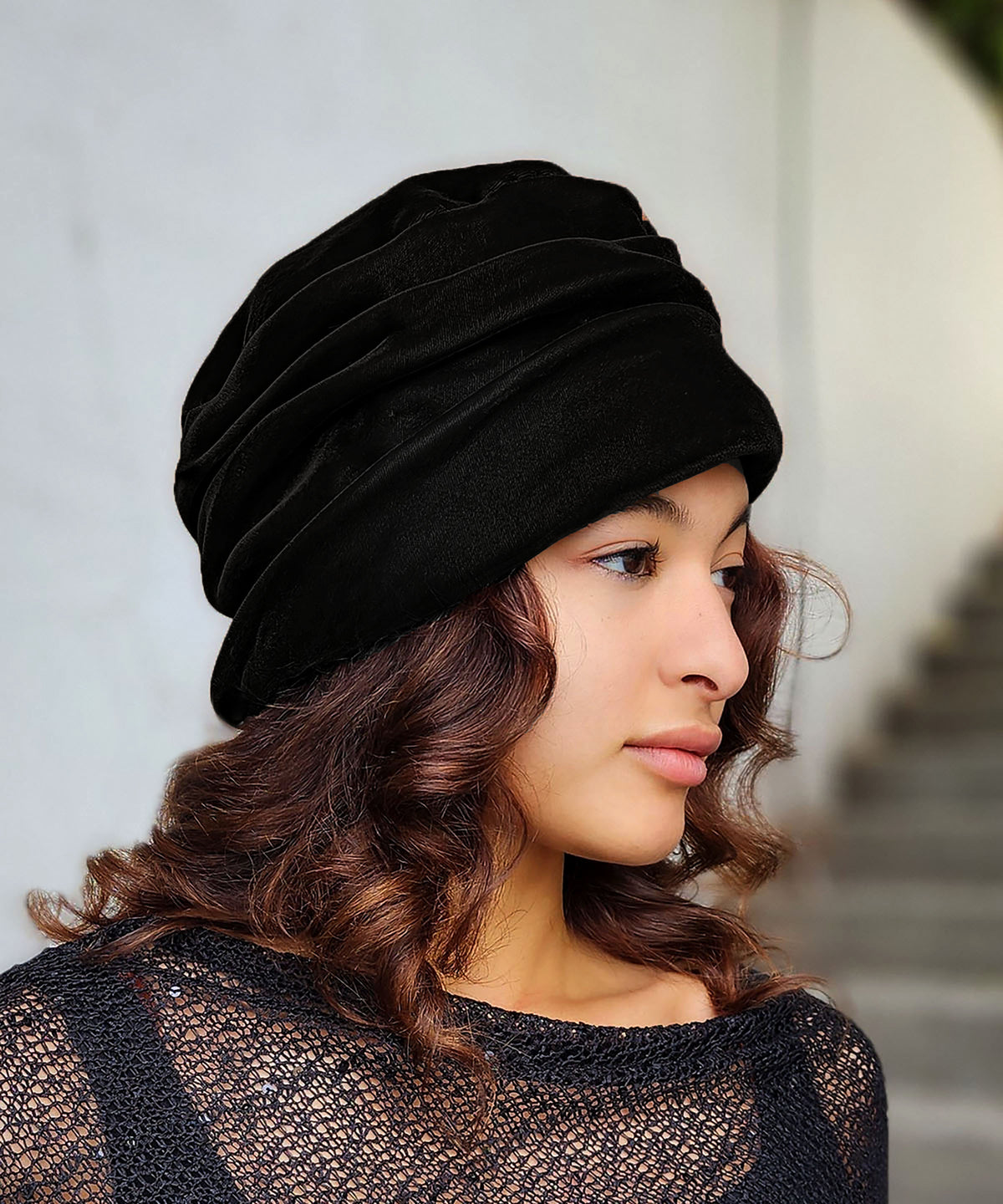 Woman wearing the Ana Cloche Hat in Black Velvet. Made in Seattle, WA, USA by Pandemonium Seattle.