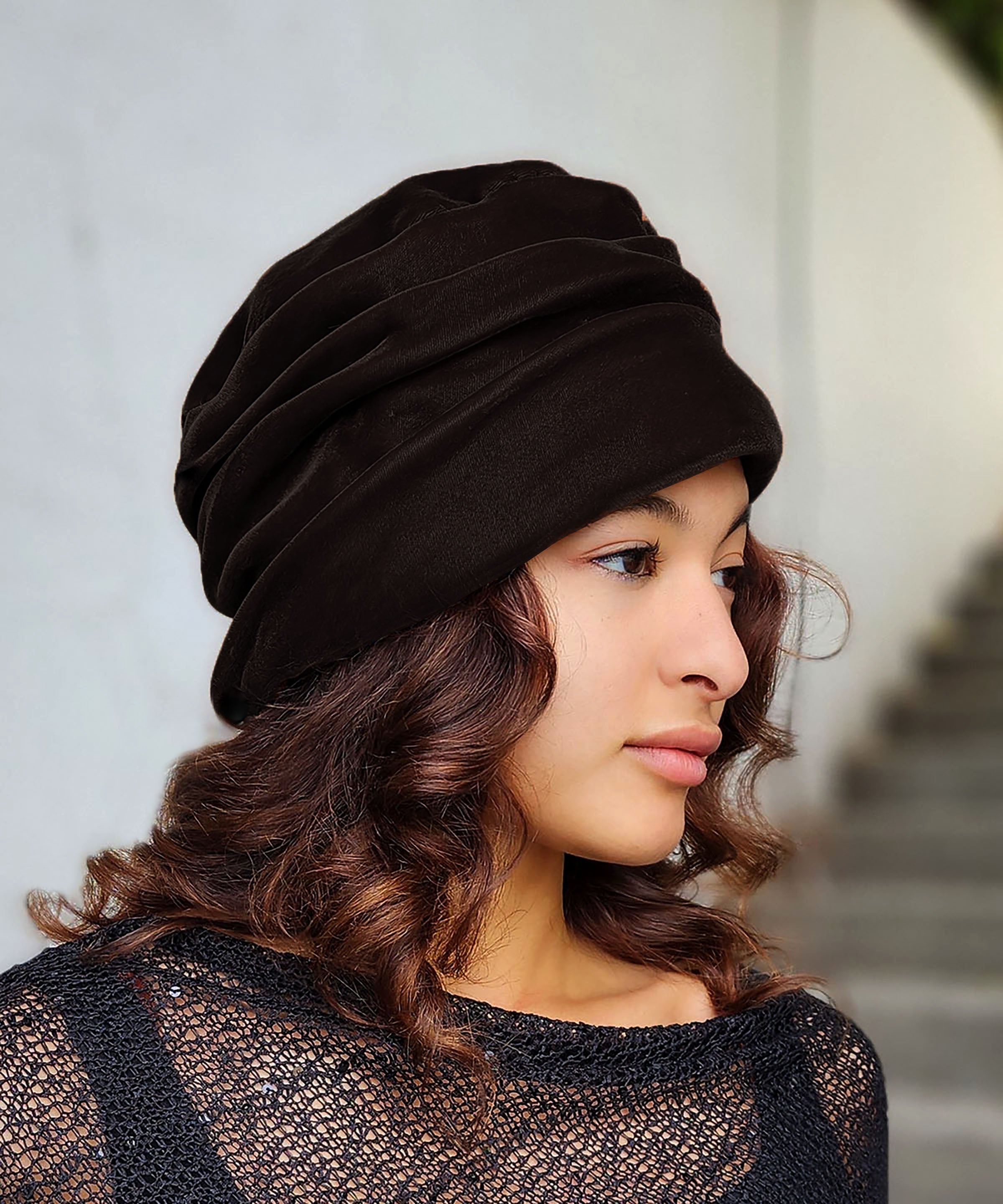 Woman wearing the Ana Cloche Hat in Chocolate Velvet. Made in Seattle, WA, USA by Pandemonium Seattle.