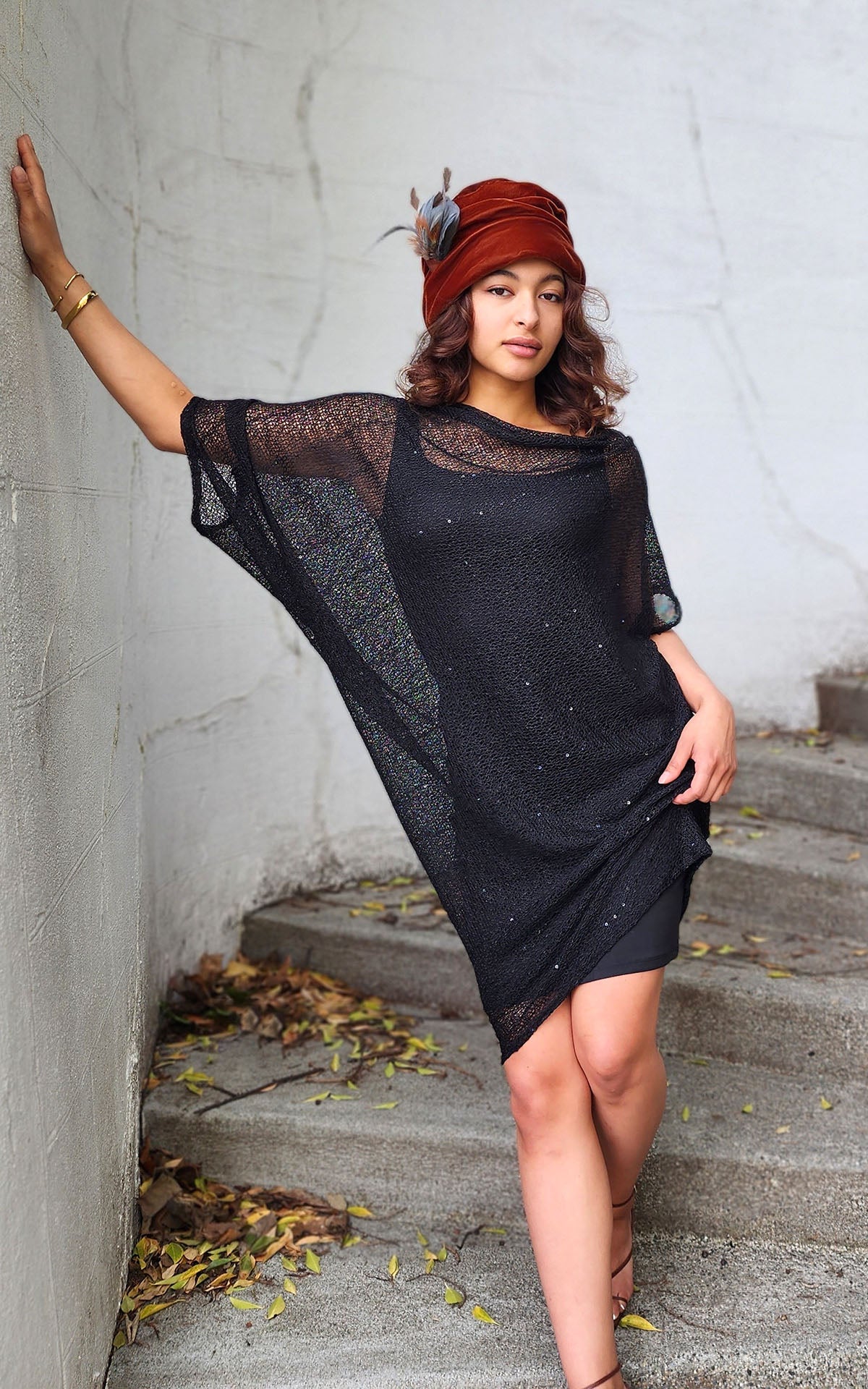 woman wearing cocoon tunic dress in black glitzy glam with citrine velvet Ana cloche hat handmade by LYC x Pandemonium in Seattle, WA, USA