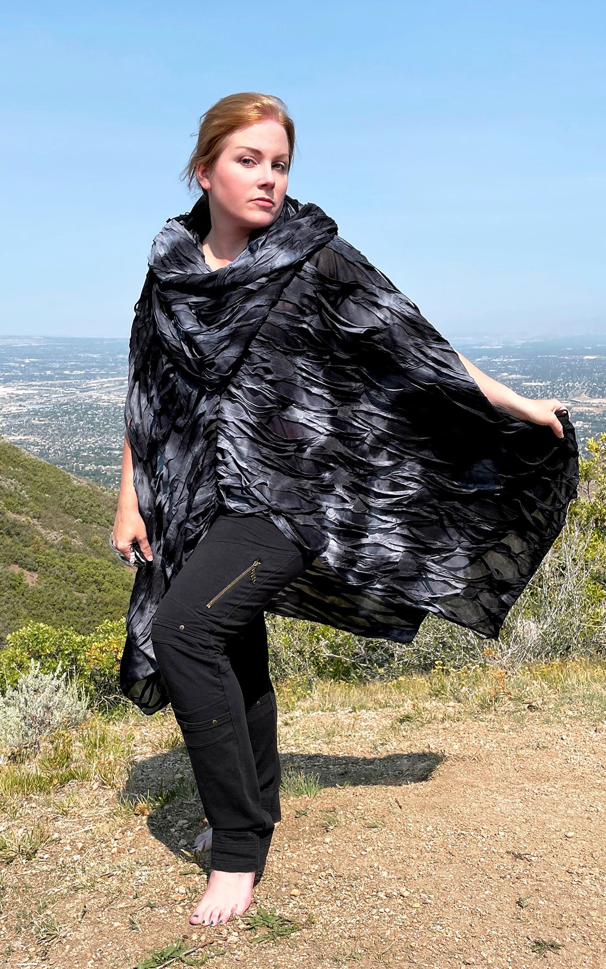 Model is wearing the Badlands Cloak with the Hood up in Andromeda Celestial Trellis by Leigh Young Collection handmade in Seattle WA