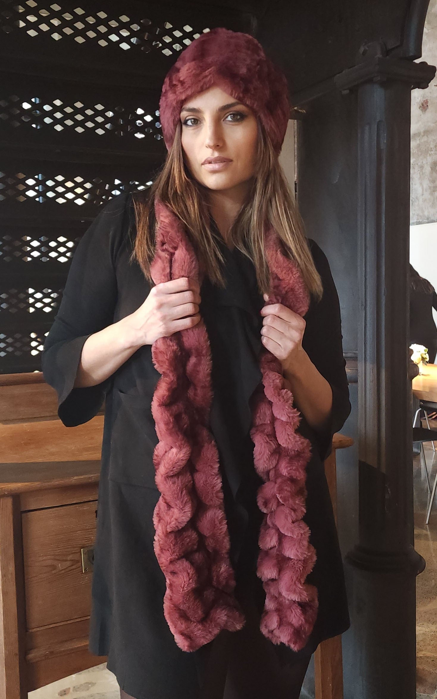 Woman wearing the Royal Opulence Skinny Scarf in Maple Glow Handmade by Pandemonium Seattle.