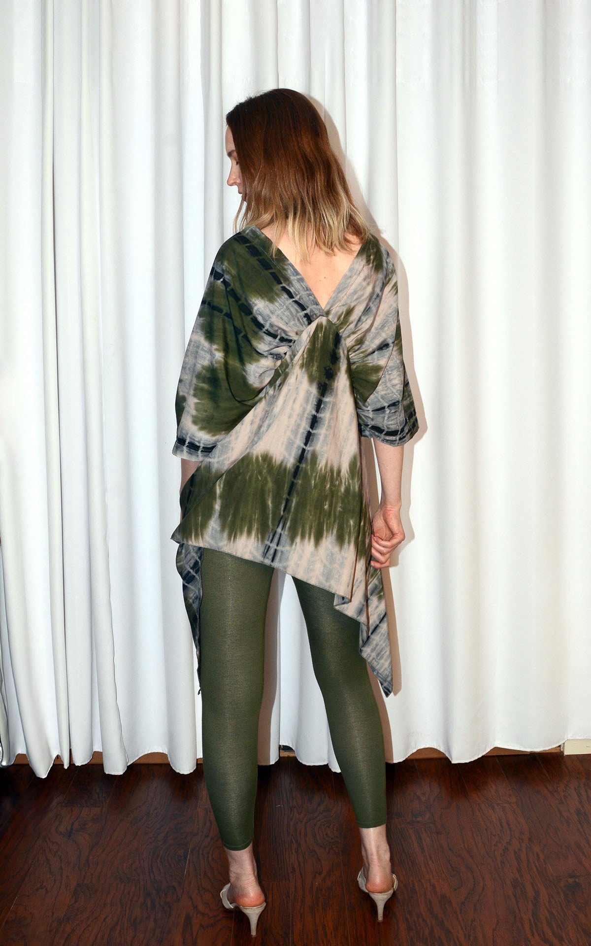 back view of woman wearing butterfly tunic top in sencha green tea handmade by LYC x Pandemonium in Seattle, WA, USA