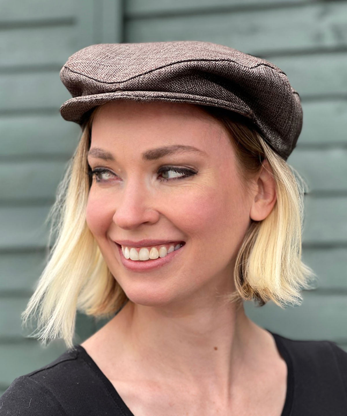 Woman wearing Pandemonium Millinery Charlie Driving Cap | Origin Upholstery Fabric in Java Brown | Handmade in Seattle WA