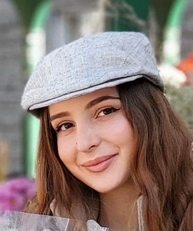 Woman wearing Pandemonium Millinery Charlie Driving Cap | Linen in Metallic Silver| Handmade By Pandemonium Millinery | Seattle WA